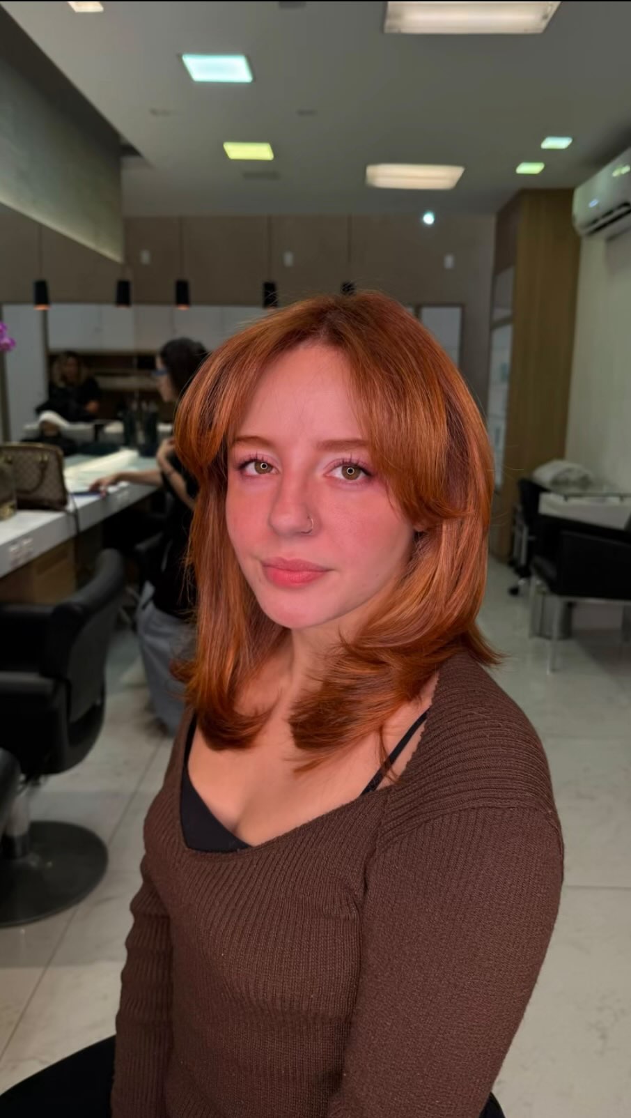 Charming Layered Mid-Length Cut with Subtle Face-Framing Highlights