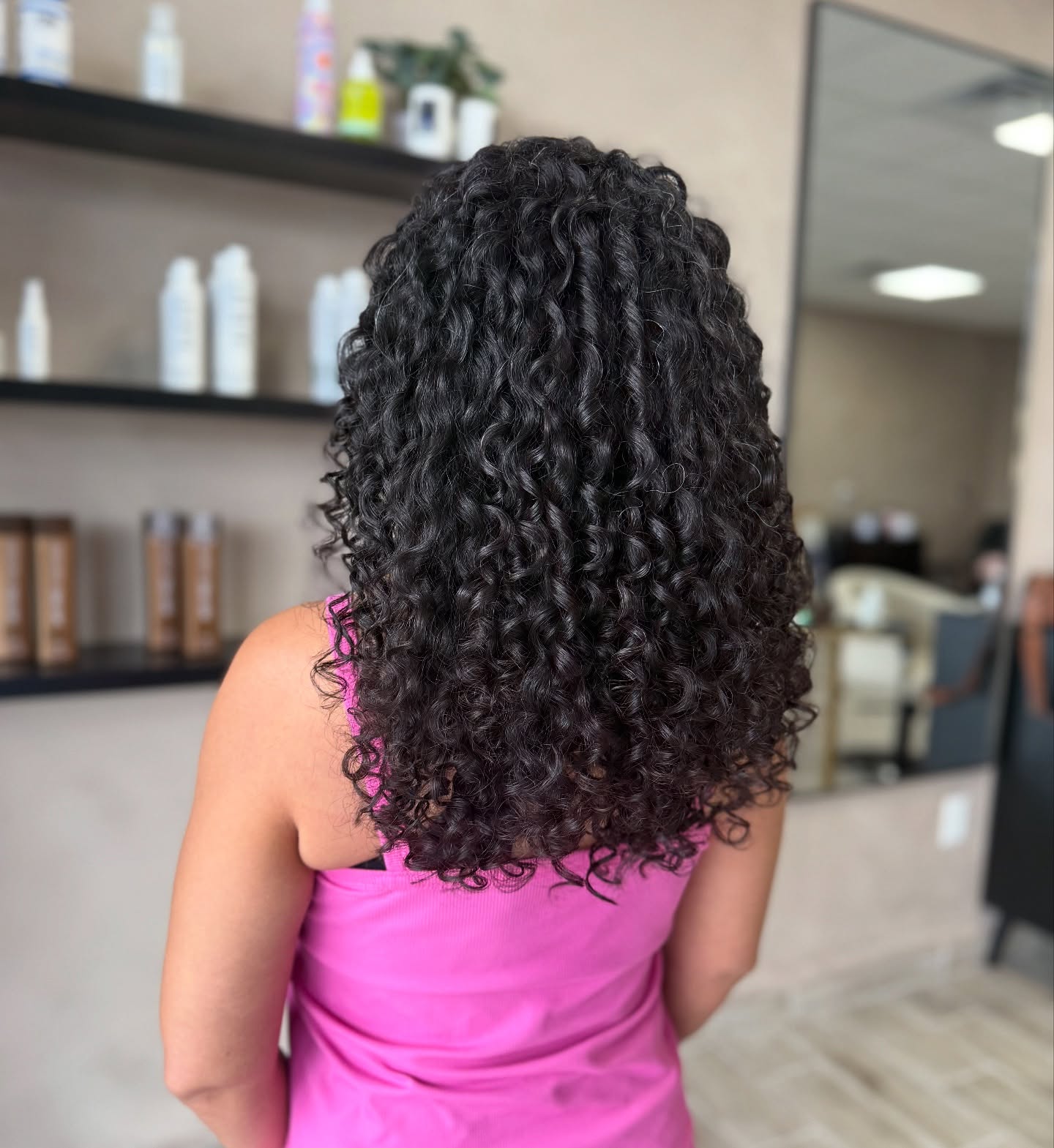 Defined Curly Shoulder-Length Cut with Volume