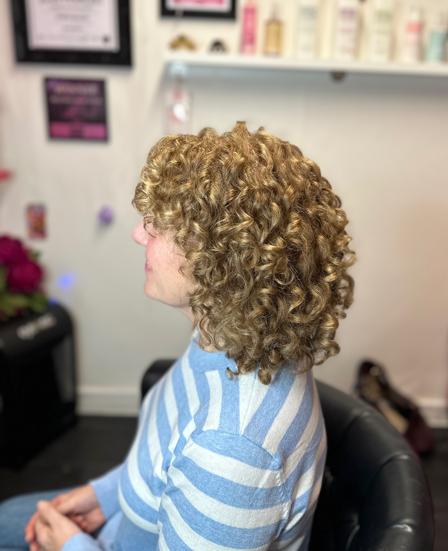 Dynamic Curly Mid-Length Cut with Defined Ringlets