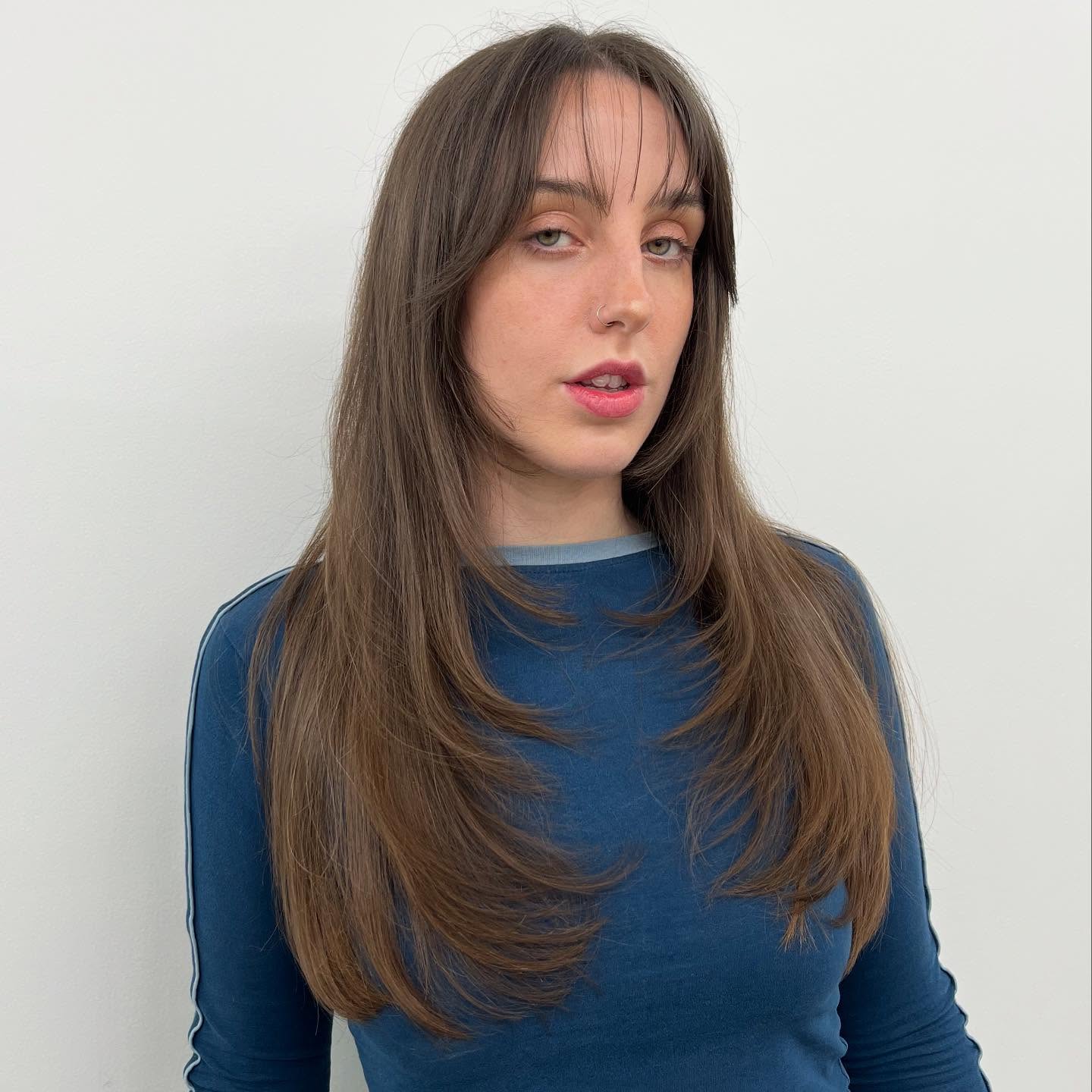 Elegant Long Layers with Wispy Bangs
