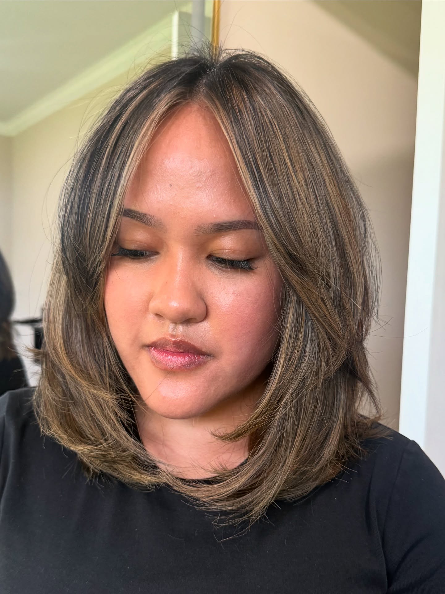 Softly Layered Mid-Length Cut with Subtle Highlights