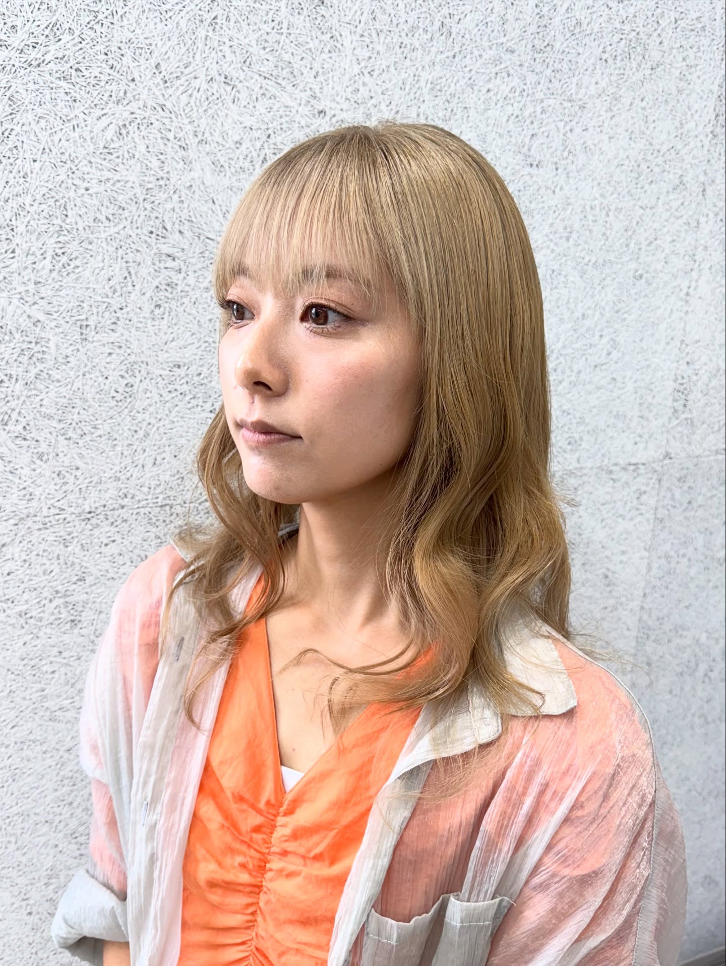 Softly Textured Mid-Length Cut with Wispy Bangs