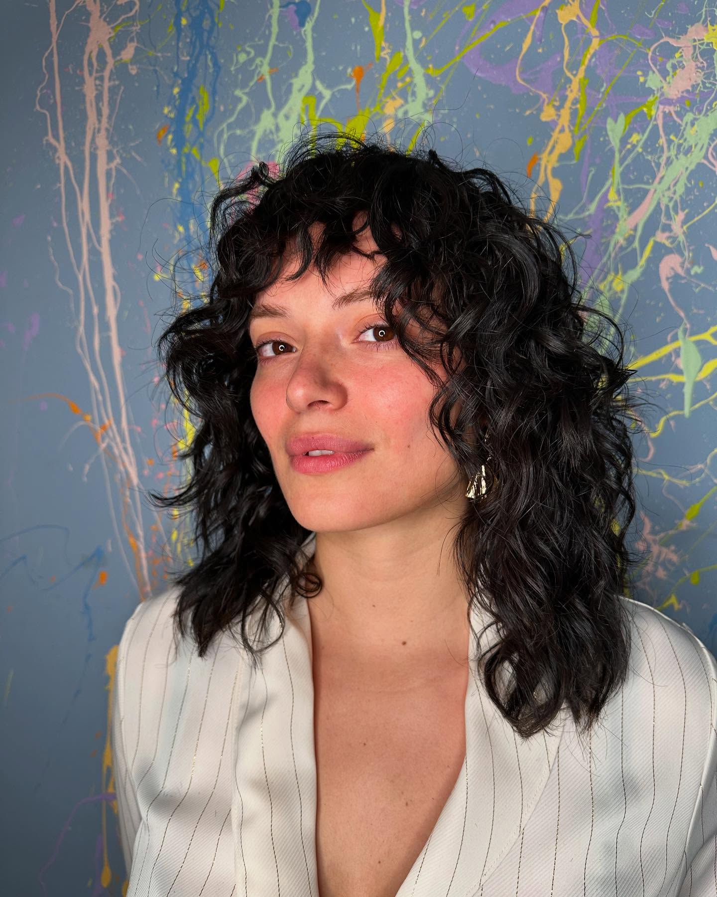 Textured Curly Mid-Length Cut with Soft Bangs