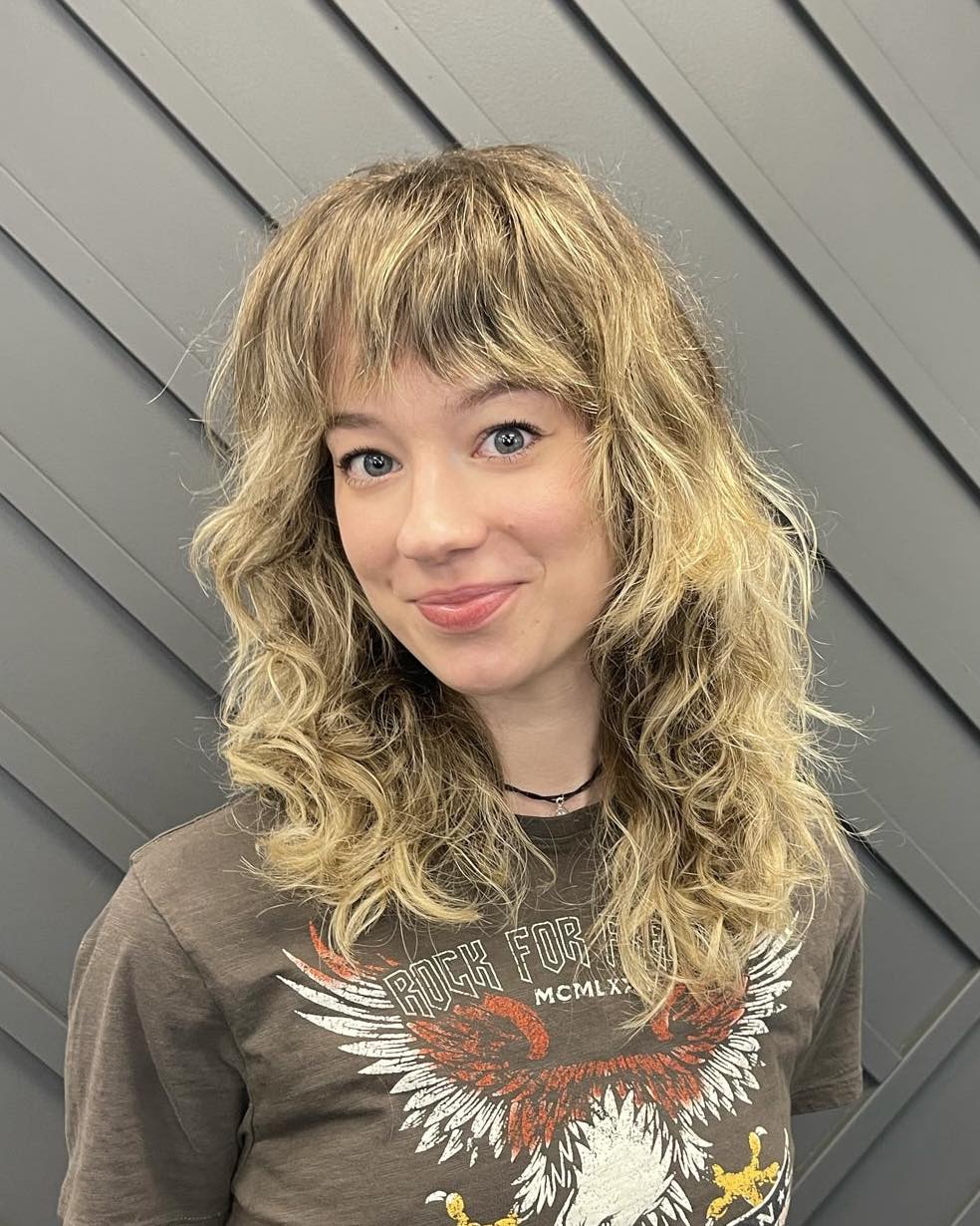 Textured Mid-Length Cut with Playful Bangs