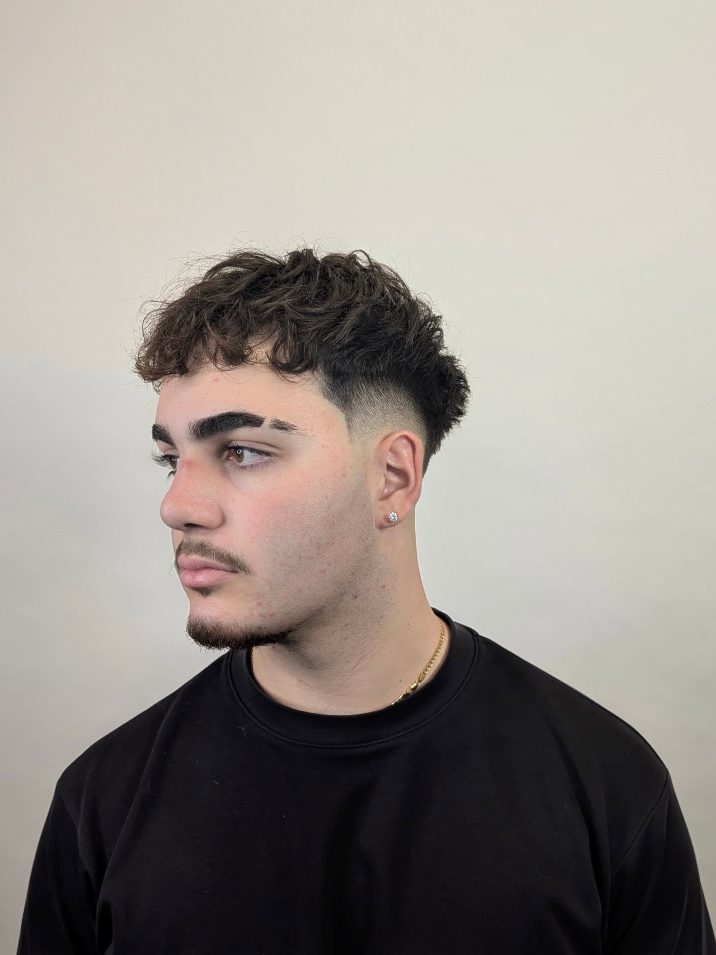 Chic Curly Crop Fade with Defined Texture