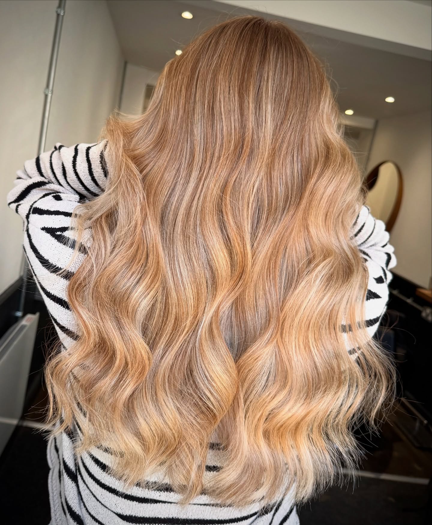 Beautifully Textured Warm Tone Blonde Balayage with Soft Waves