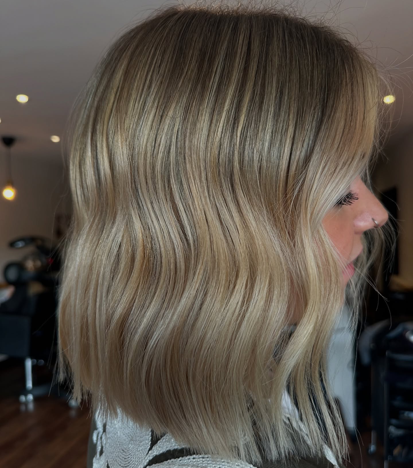 Chic Wavy Warm Tone Blonde Balayage with Subtle Texture