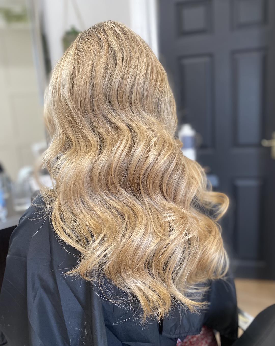 Glamorous Warm Tone Blonde Balayage with Subtle Waves