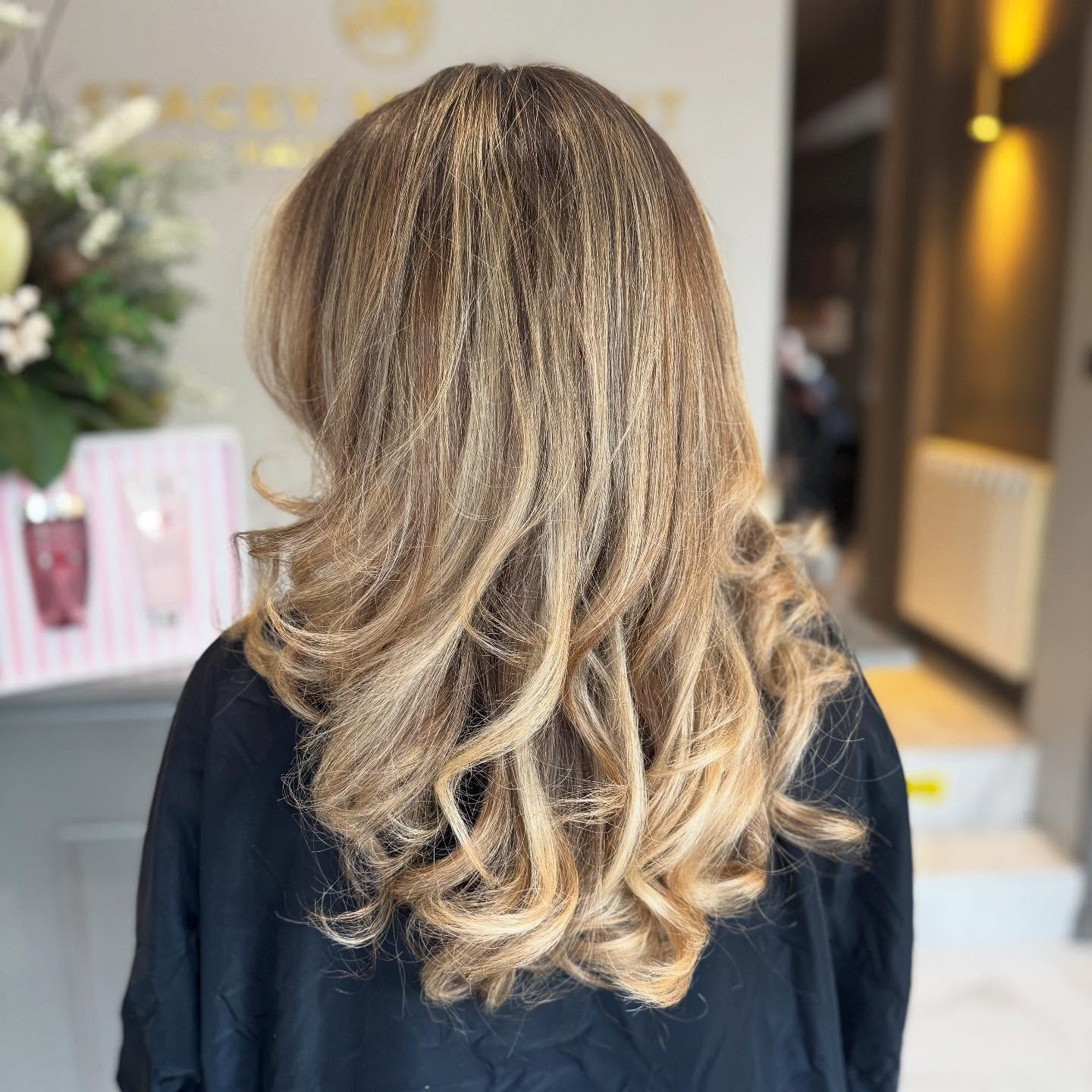 Luxurious Warm Tone Blonde Balayage with Soft Curls