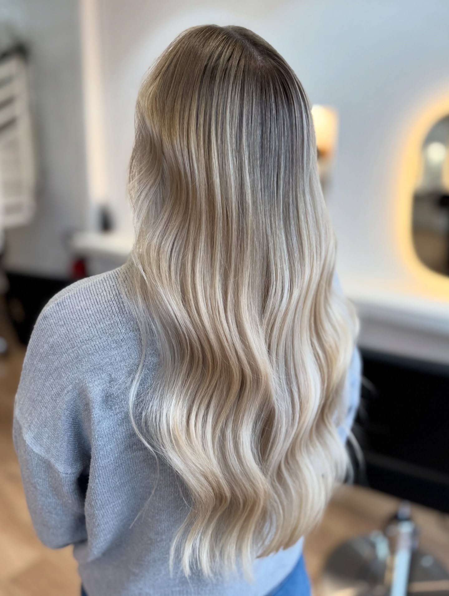 Radiant Long Vanilla Blonde Waves with Soft Dimension