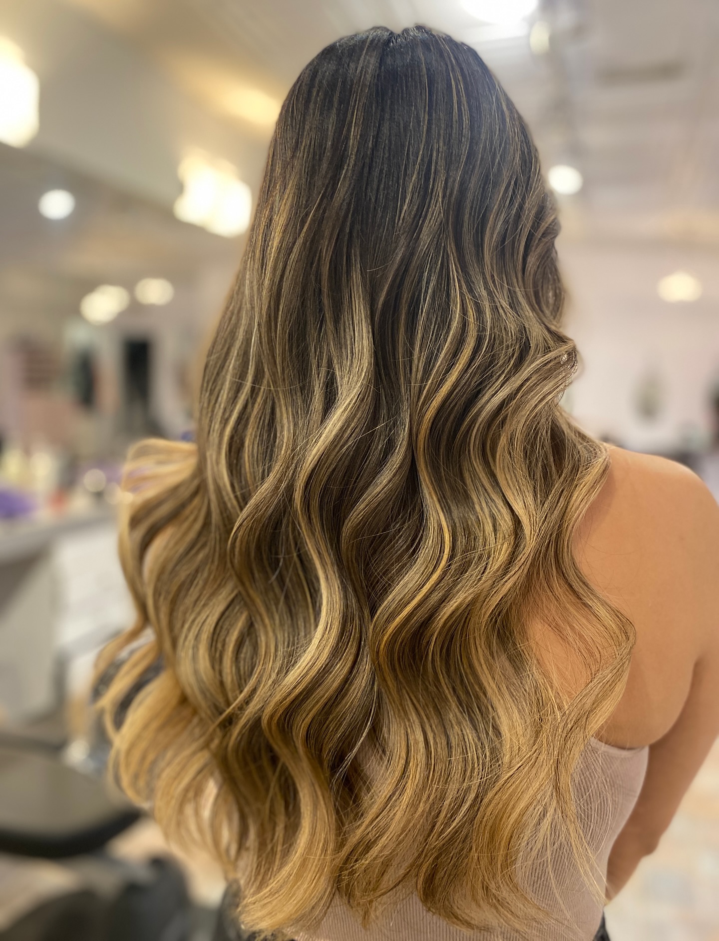 Radiant Warm Tone Blonde Balayage with Defined Waves