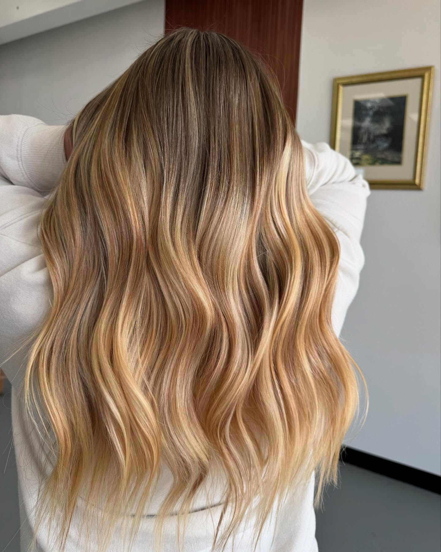 Radiant Warm Tone Blonde Balayage with Luminous Waves