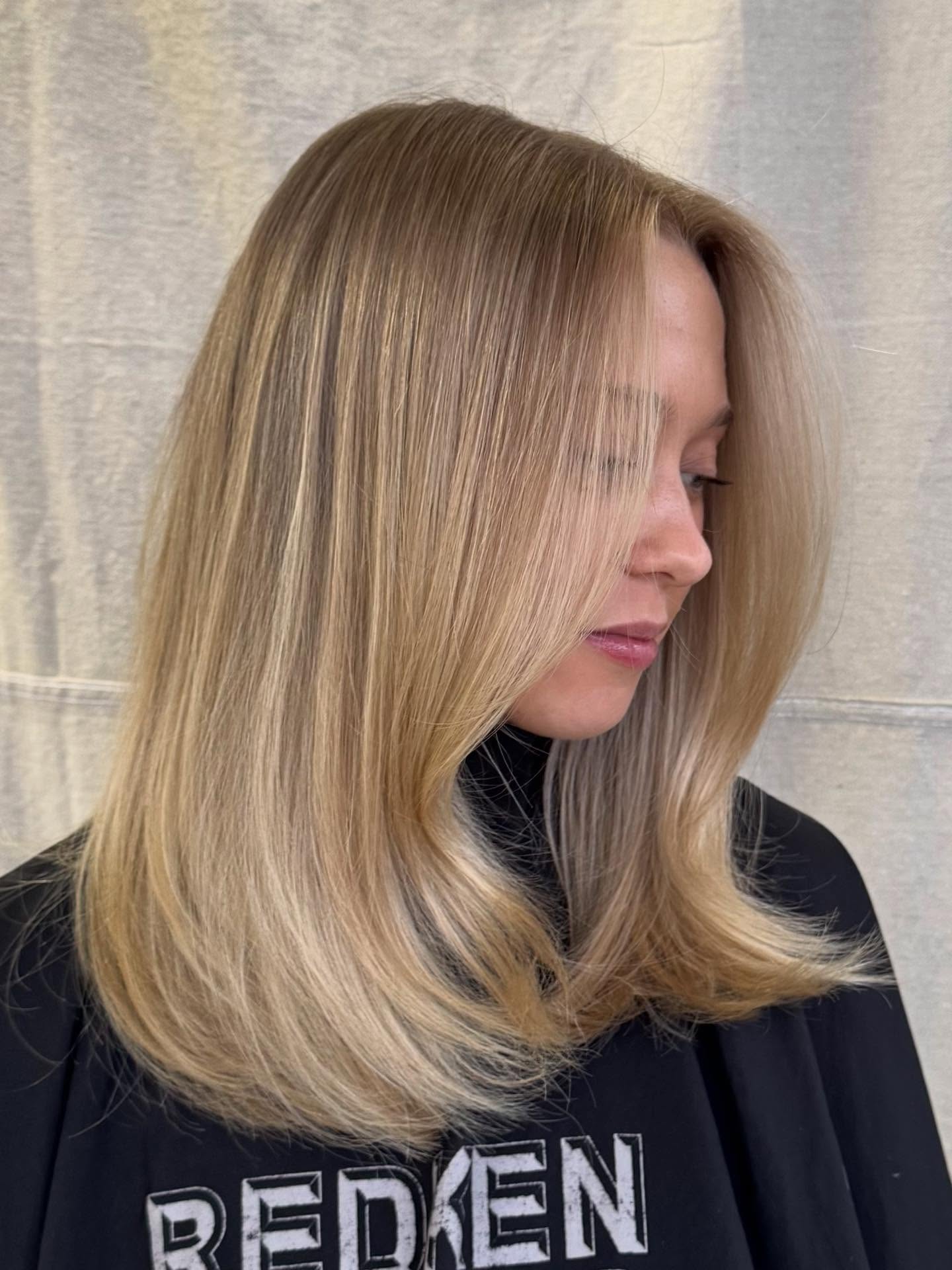 Sleek Warm Tone Blonde Balayage with Subtle Movement