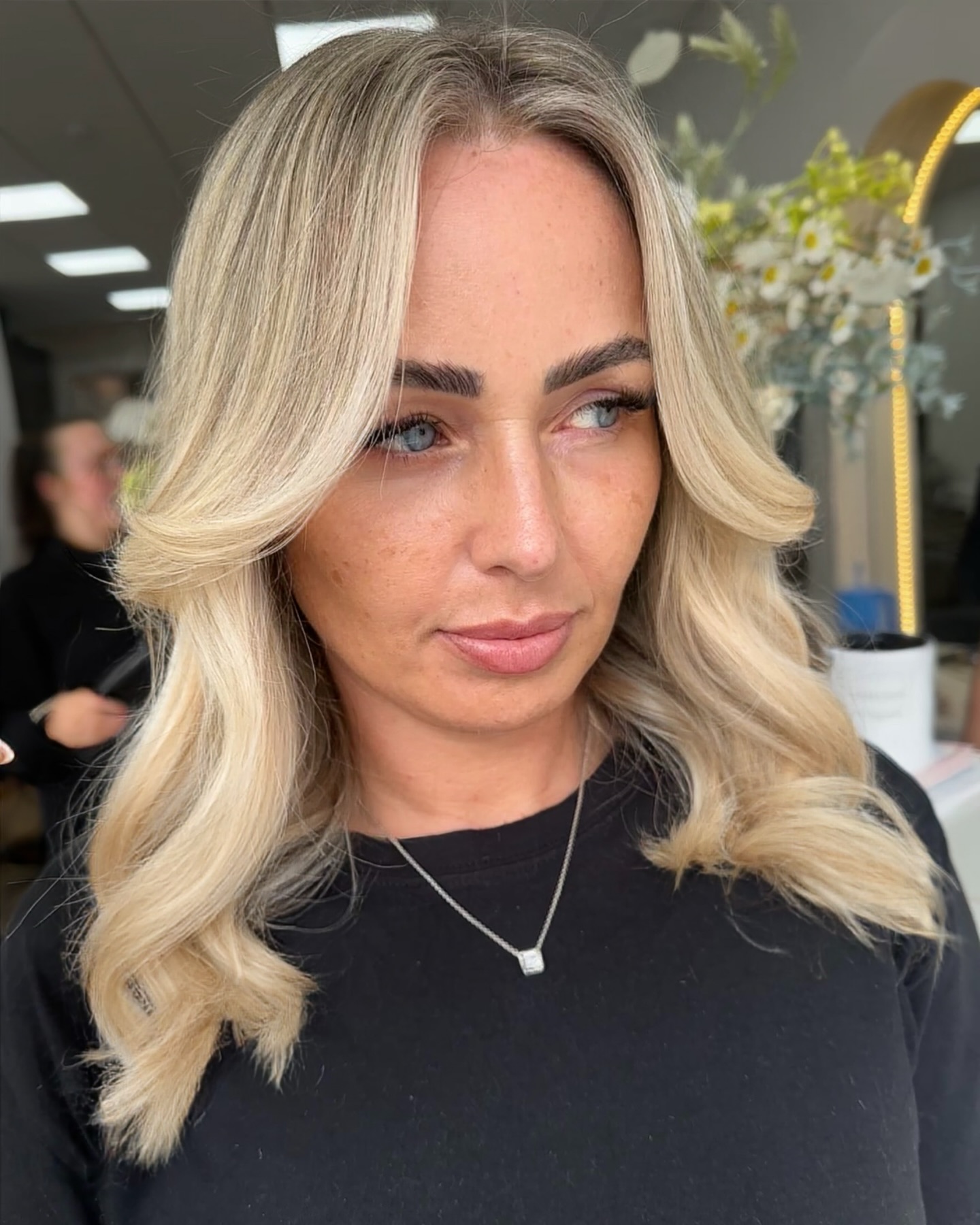 Soft Blended Vanilla Blonde Waves with Face-Framing Layers