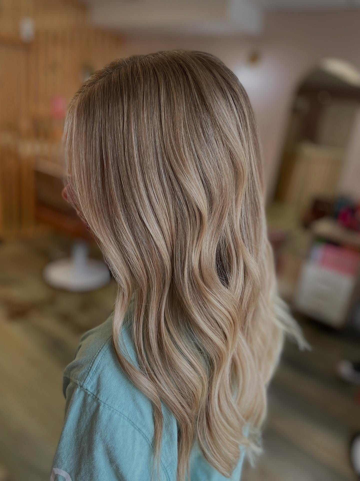 Softly Layered Warm Tone Blonde Balayage with Beachy Waves