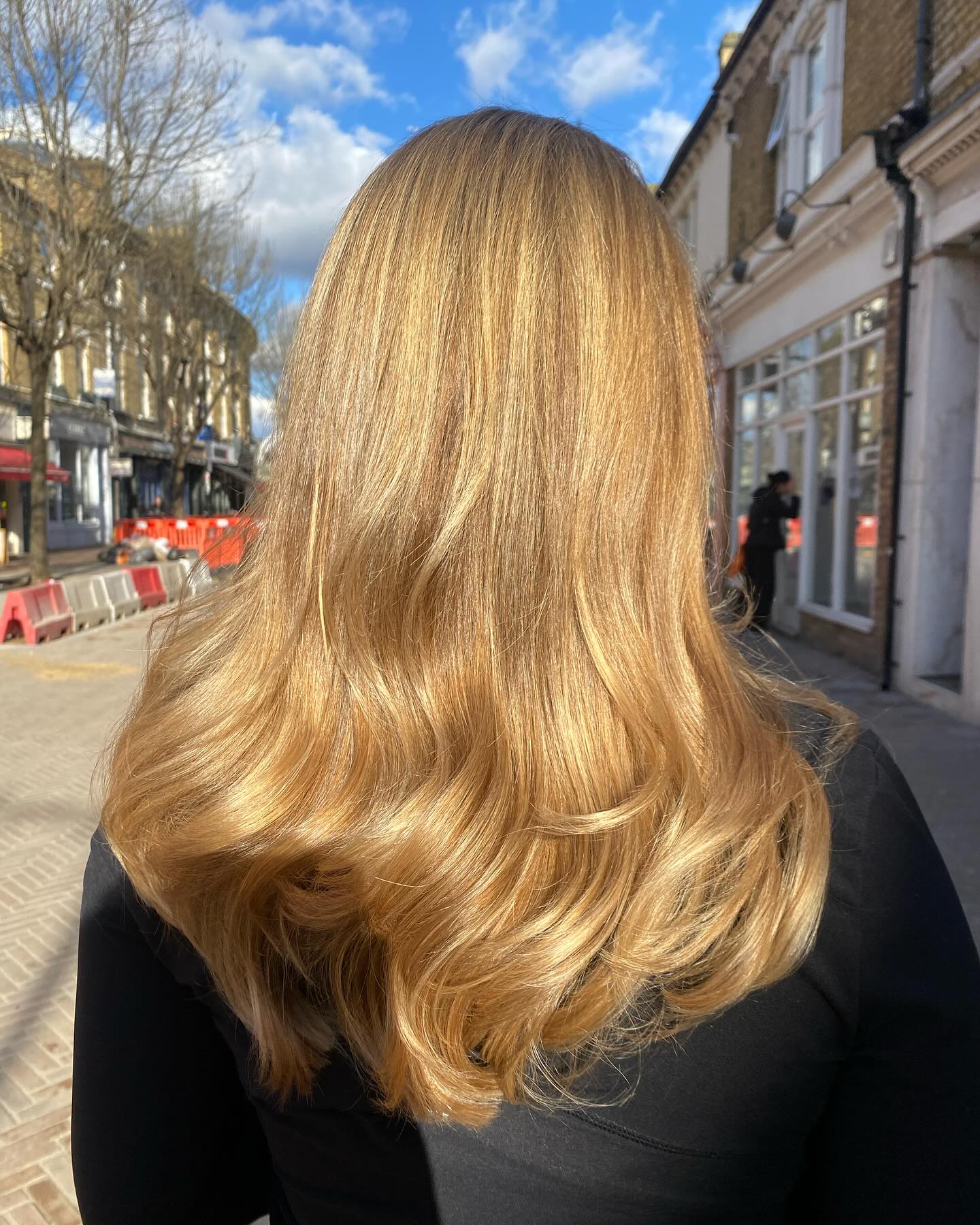 Warm Tone Blonde Balayage with Soft Waves