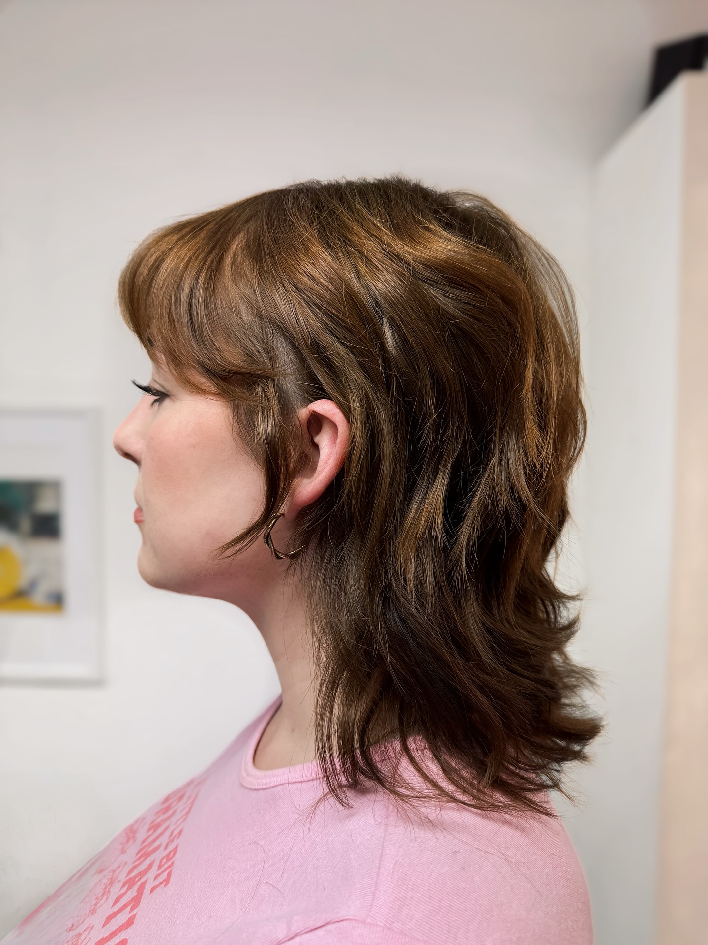 Playful Mid-Length Layered Shag with Soft Flicks