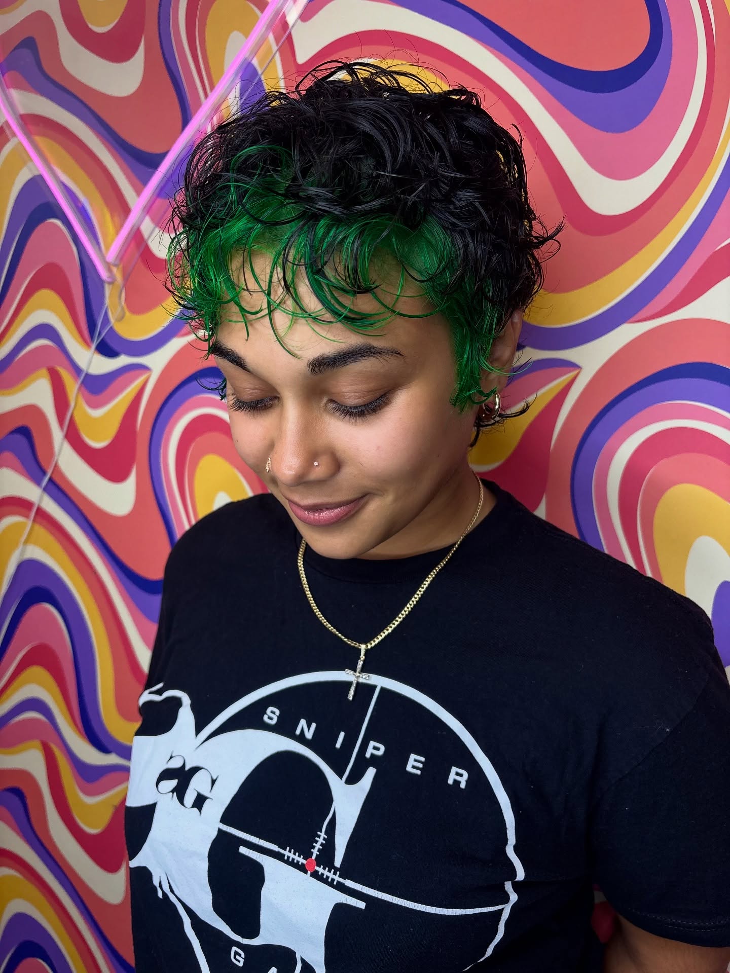 Chic Textured Curly Cut with Bold Green Highlights