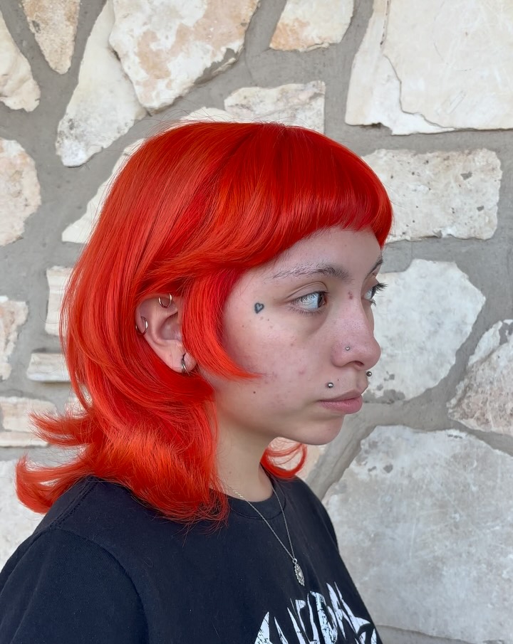 Bold Choppy Lob with Vibrant Orange Color