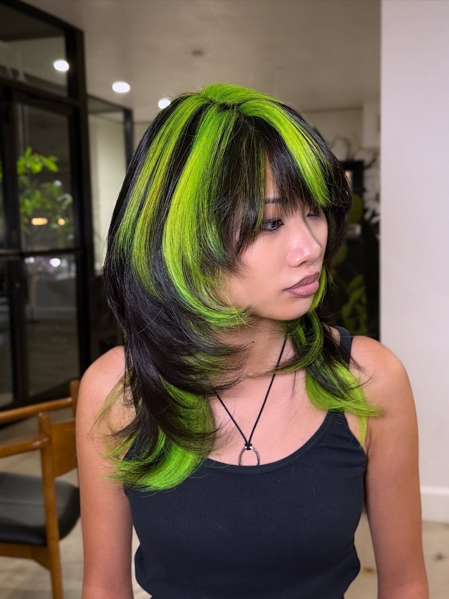Bold Layered Cut with Neon Green Highlights