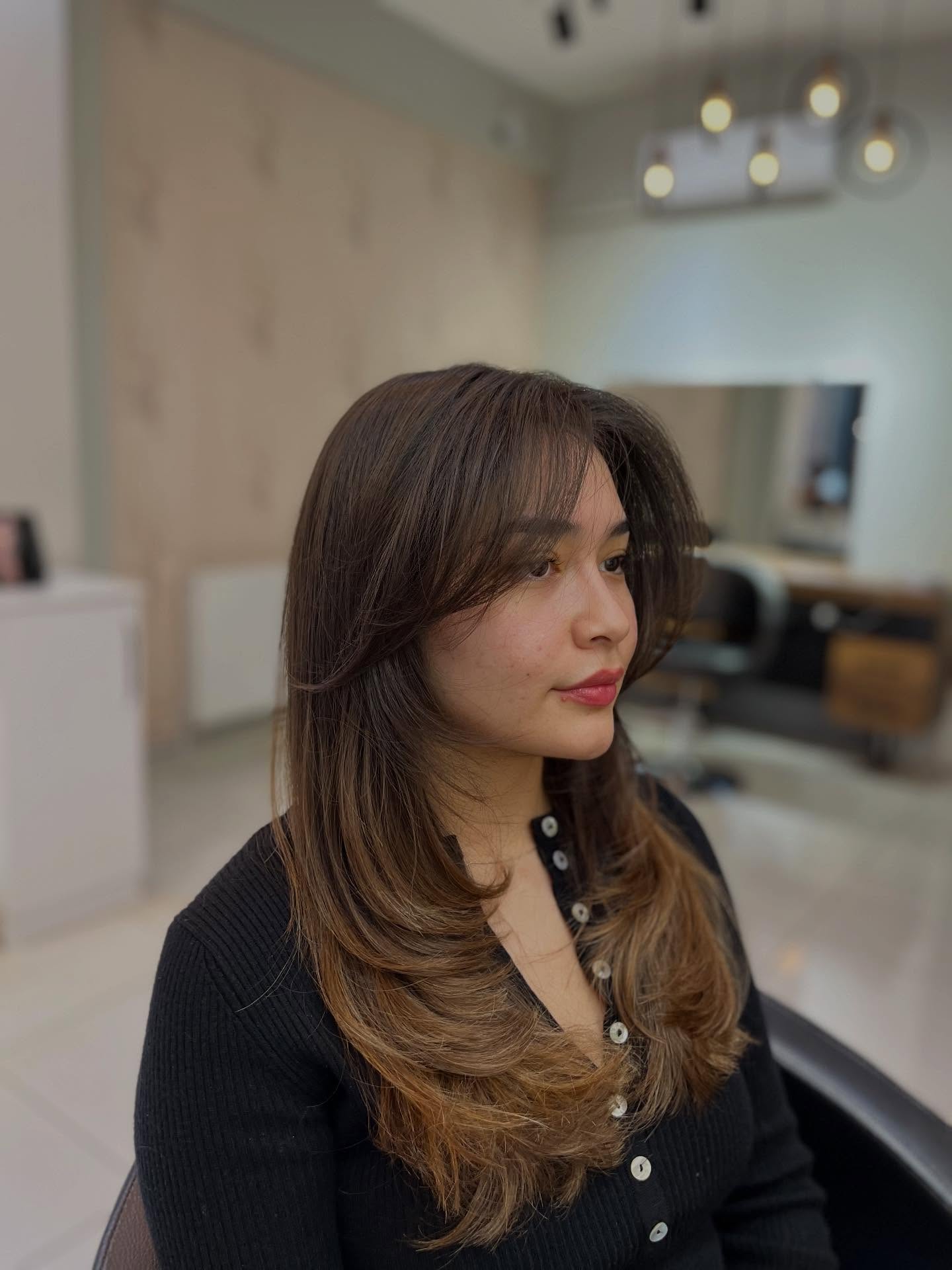 Chic Layered Butterfly Haircut with Bangs