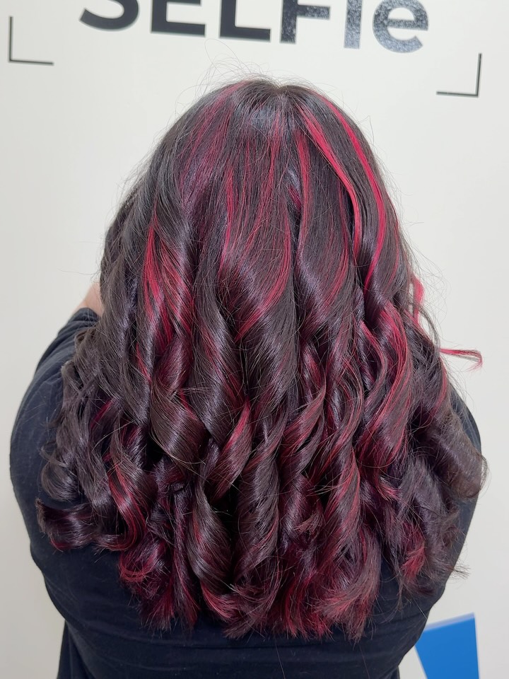Dynamic Curls with Bold Red Highlights