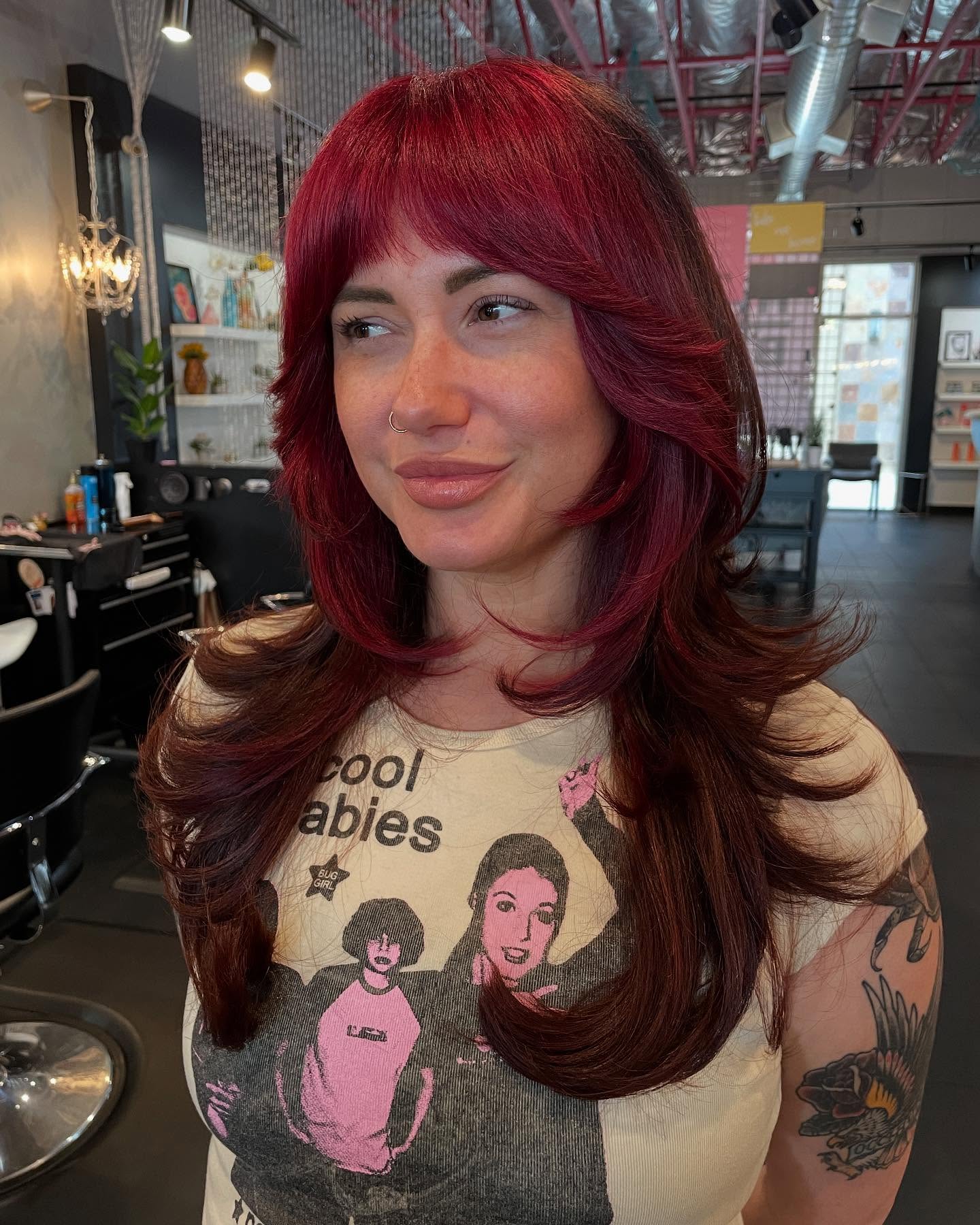 Dynamic Long Hair with Bold Burgundy Highlights