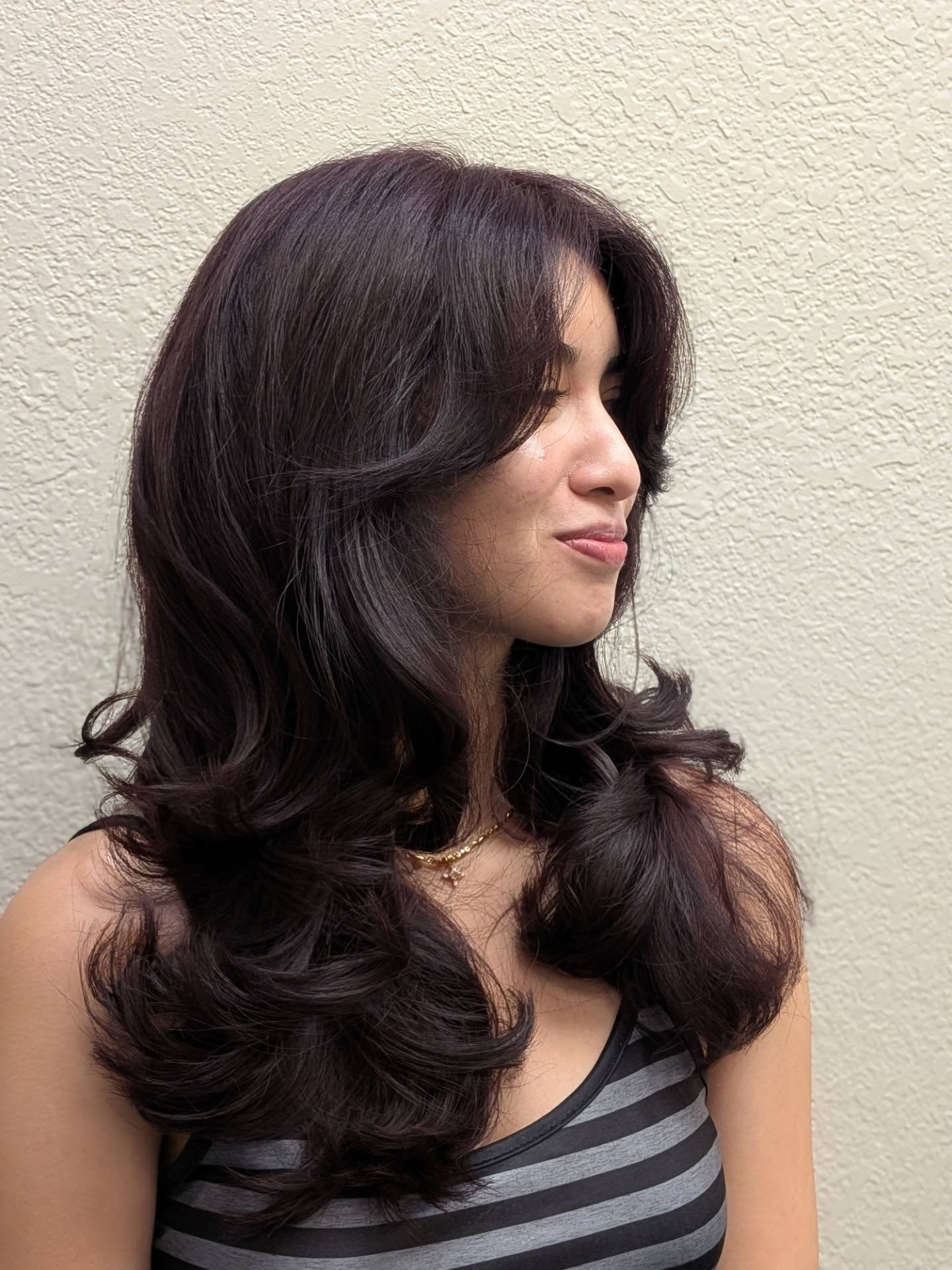 Elegant Chocolate Butterfly Haircut with Bangs