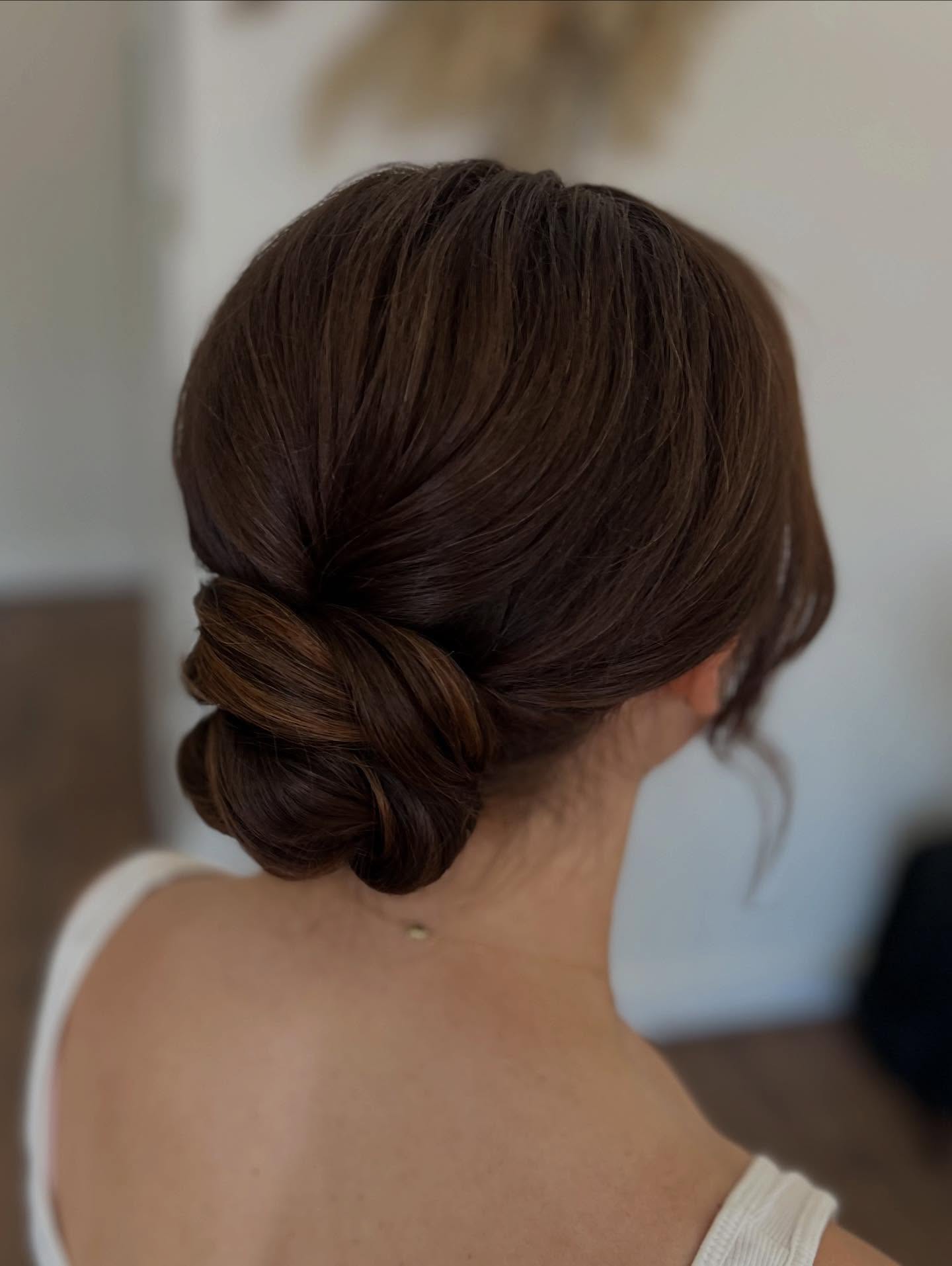 Elegant Twisted Low Bun with Subtle Highlights