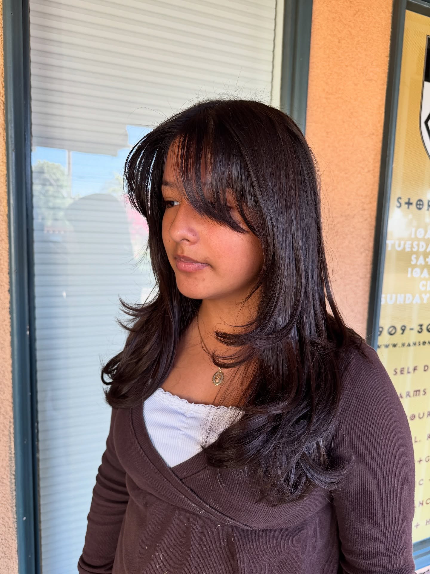 Layered Butterfly Haircut with Soft Wispy Bangs