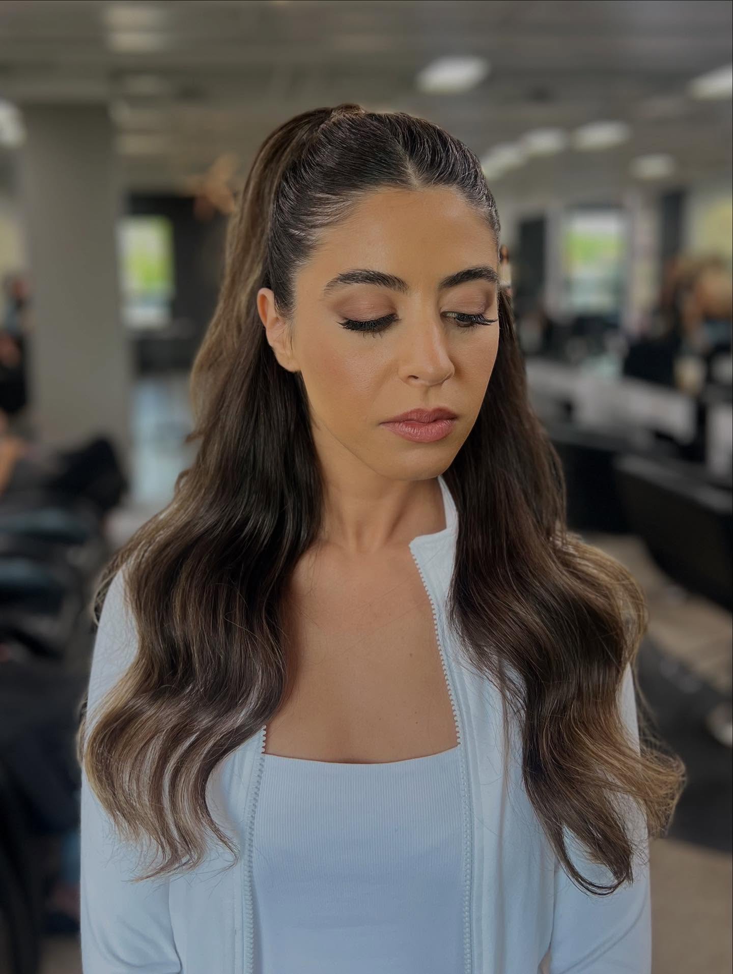 Sleek Half-Up Wave with Subtle Highlights