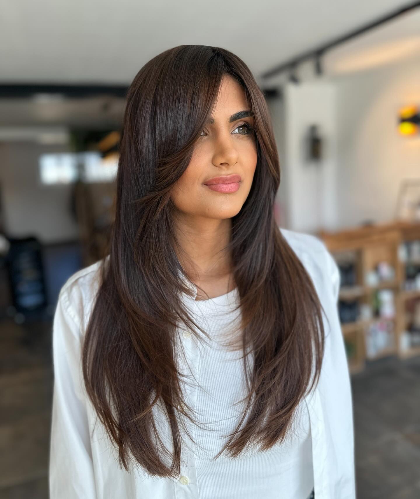 Sleek Layered Butterfly Haircut with Side Bangs