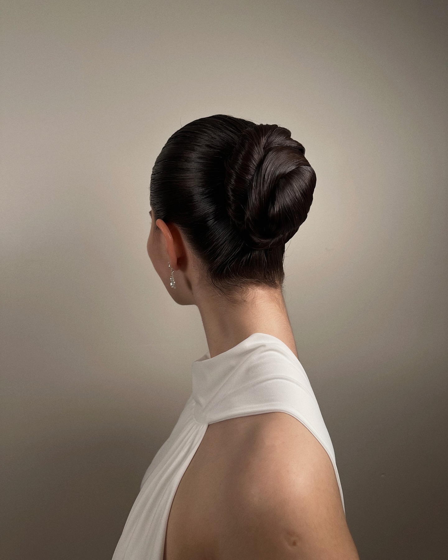 Sleek Low Bun with Intricate Twist