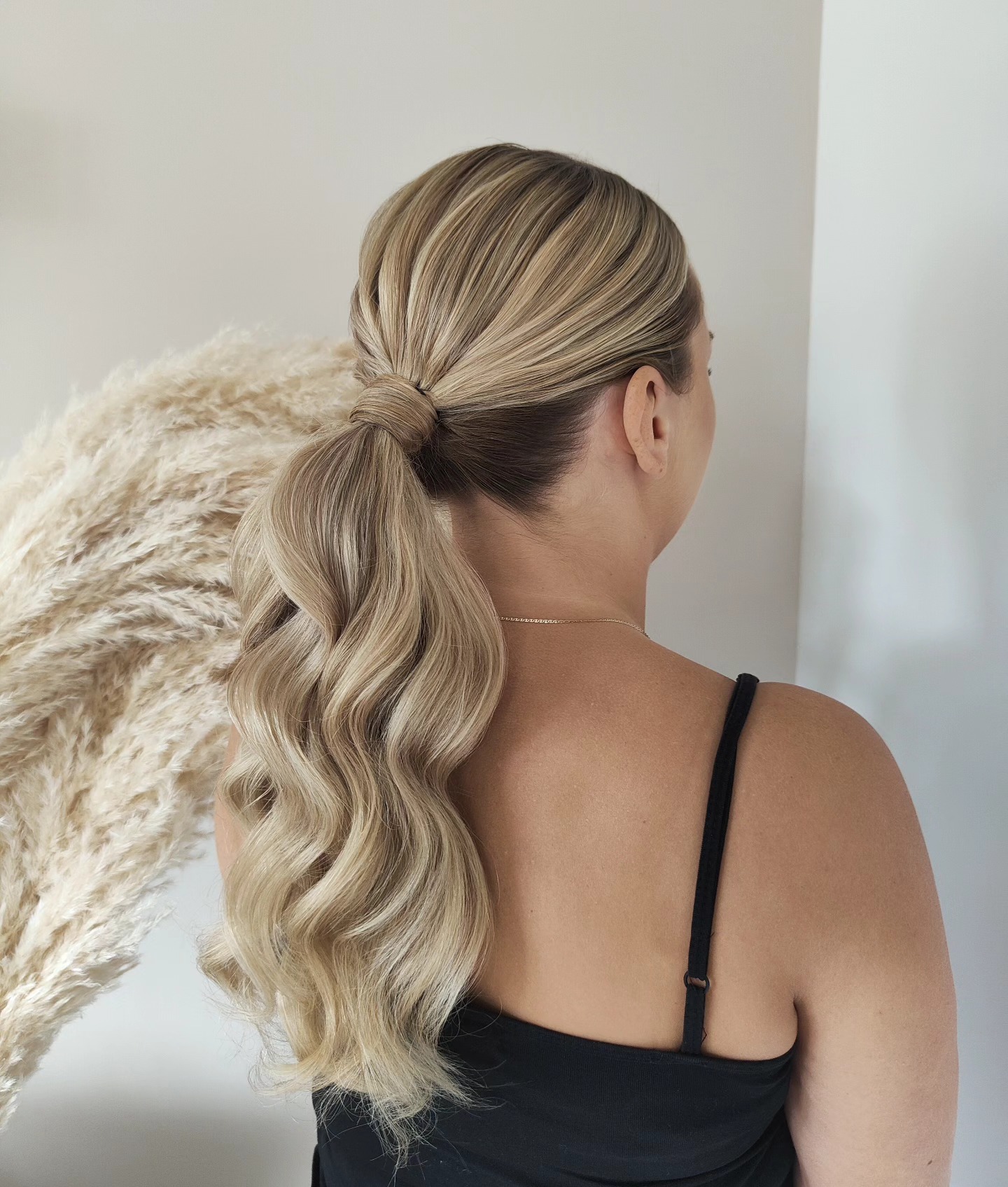 Sleek Textured Low Ponytail with Soft Waves