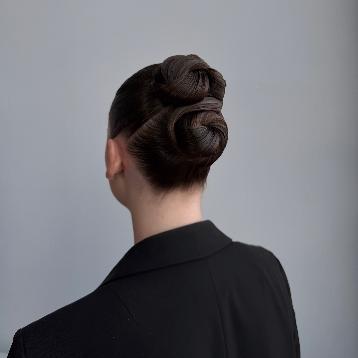 Sleek Twisted Chignon with Glossy Finish