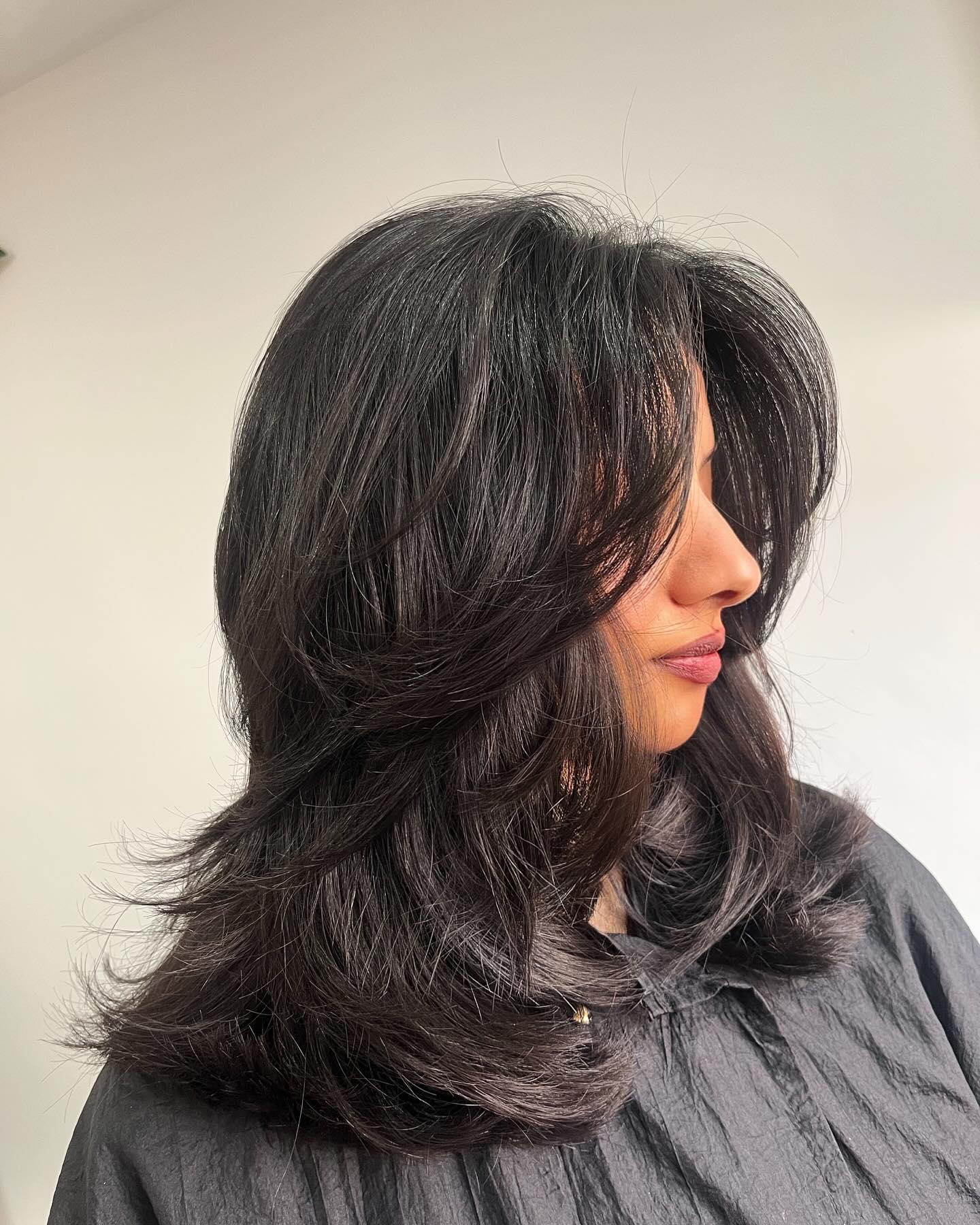 Textured Butterfly Cut with Side-Swept Bangs