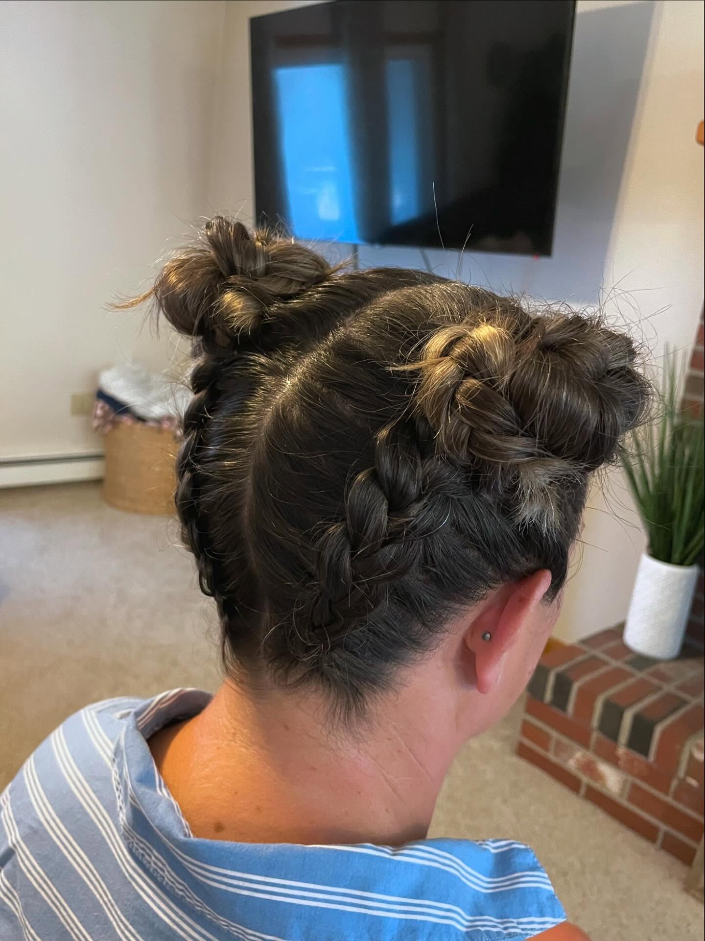 Chic Double Buns with Intricate Braids