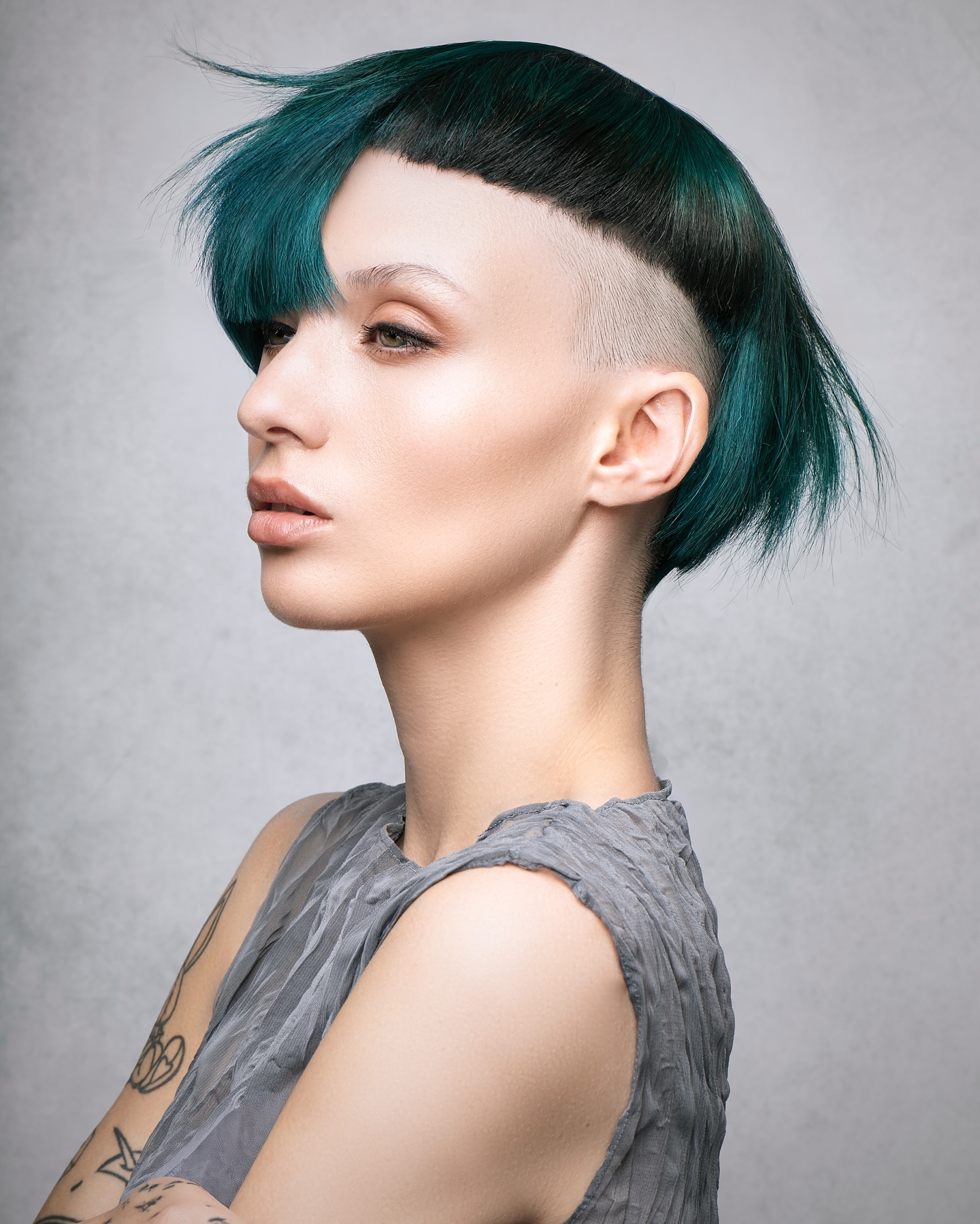 Edgy Teal-Tipped Asymmetrical Cut with Undercut