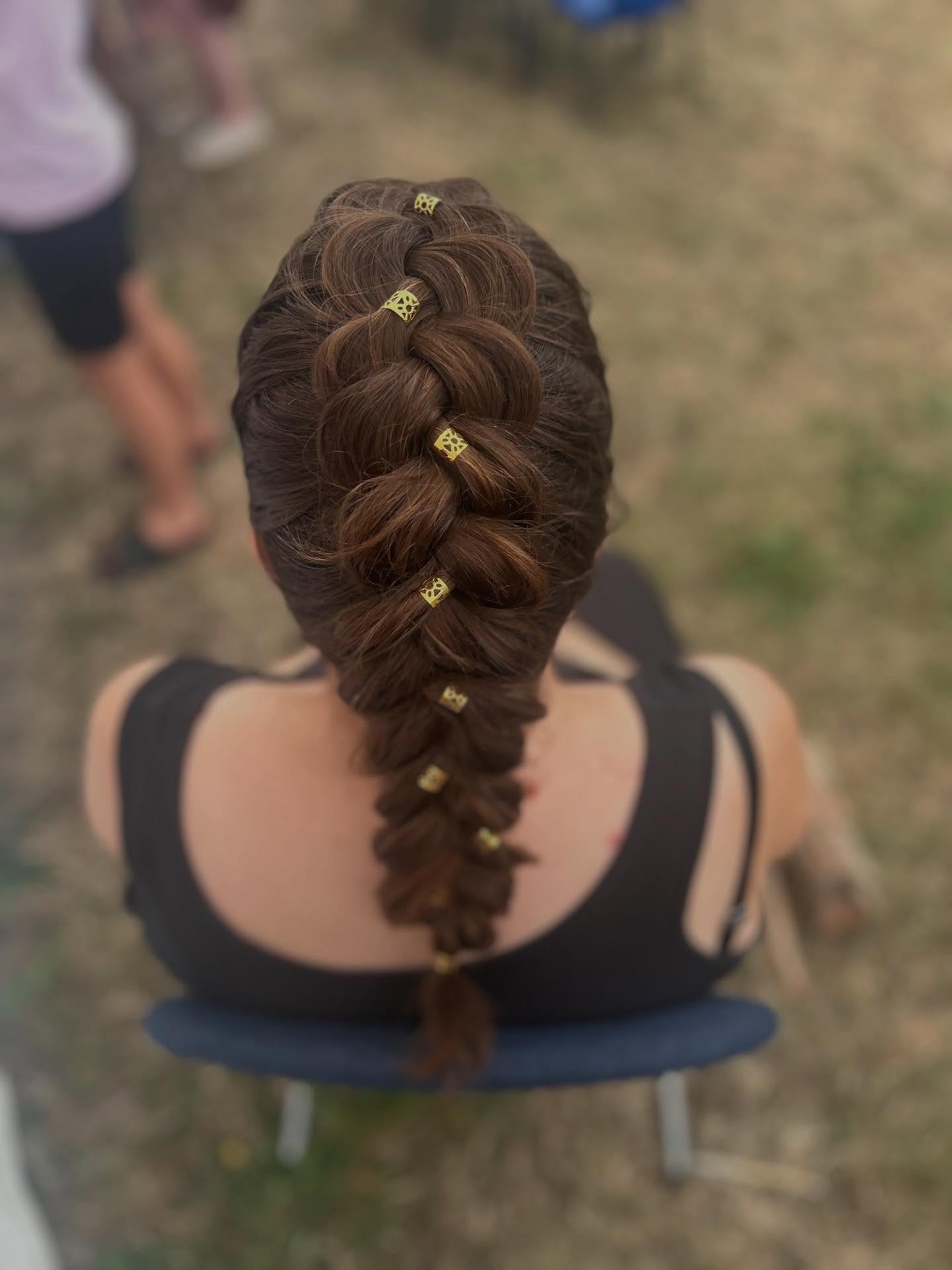 Elegant Braided Hairstyle with Decorative Hair Accessories