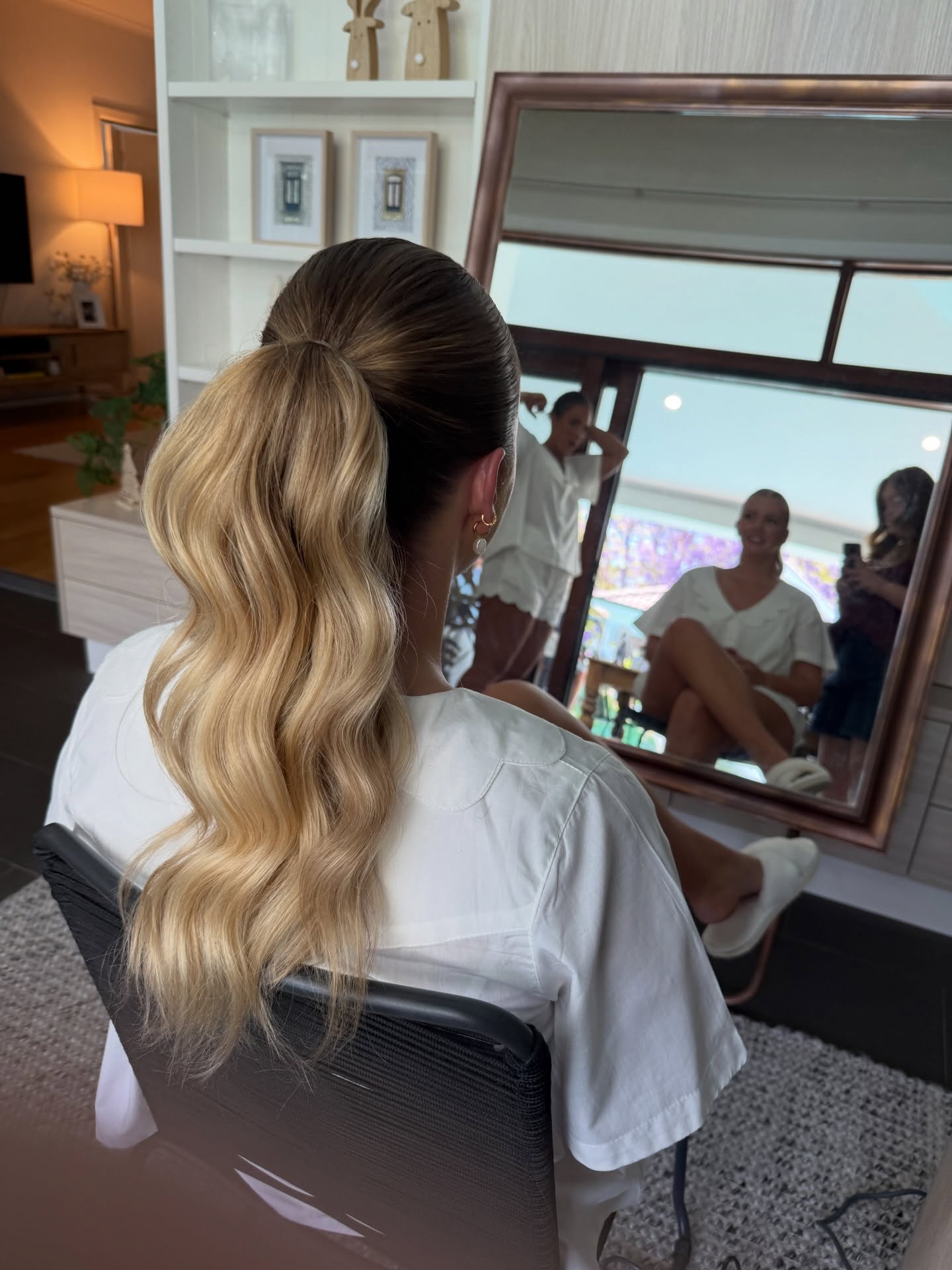 Elegant Wavy High Ponytail with Subtle Highlights