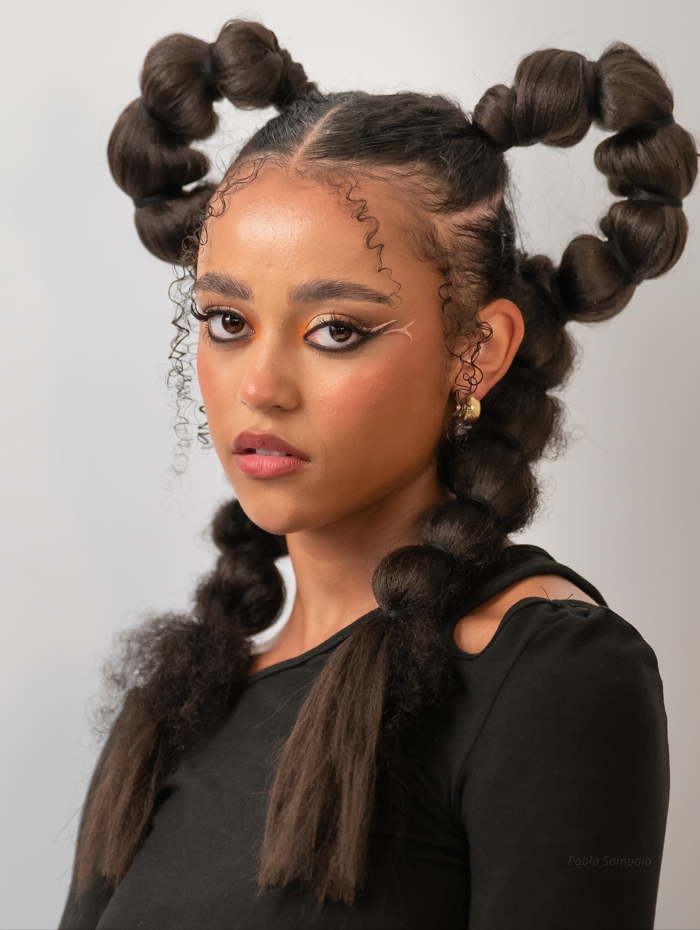 Playful Double Bun with Textured Braids