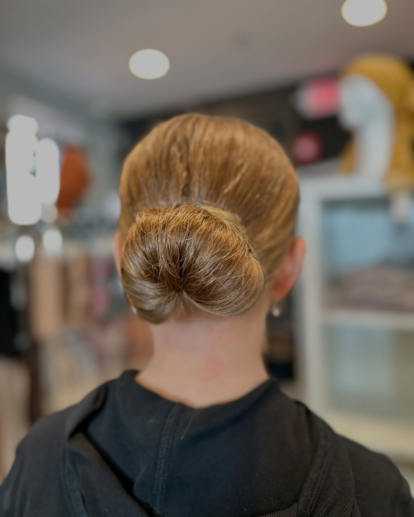 Sleek Low Bun with Glossy Finish