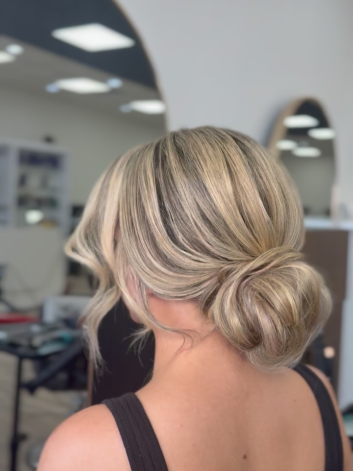 Soft Textured Low Bun with Sun-Kissed Highlights