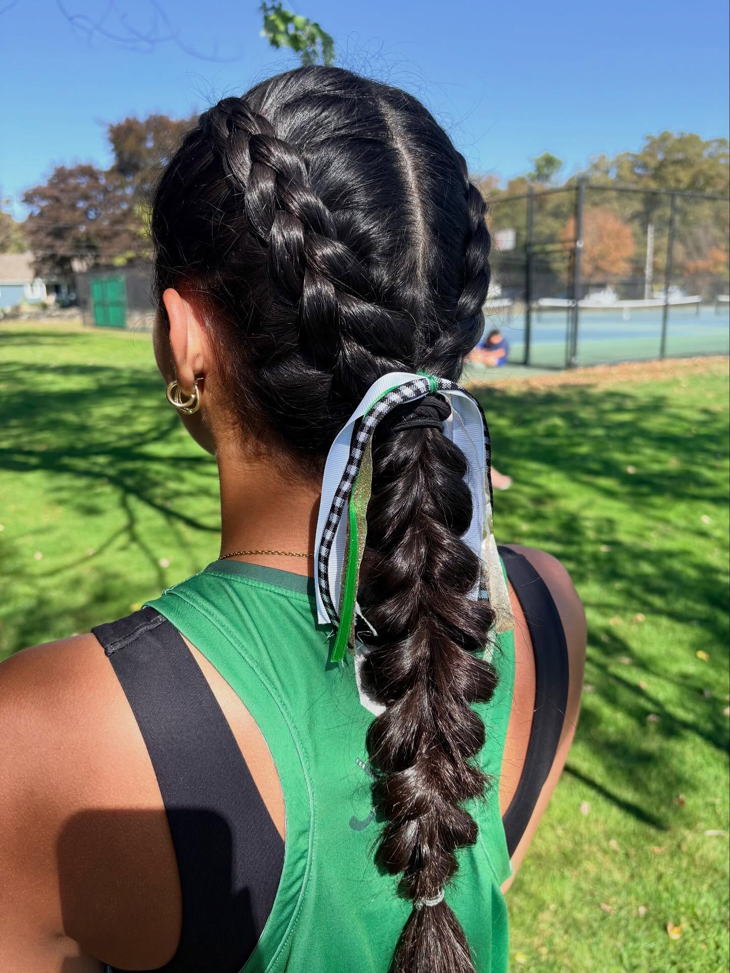 Sporty Double Dutch Braids with Playful Ribbon Accents