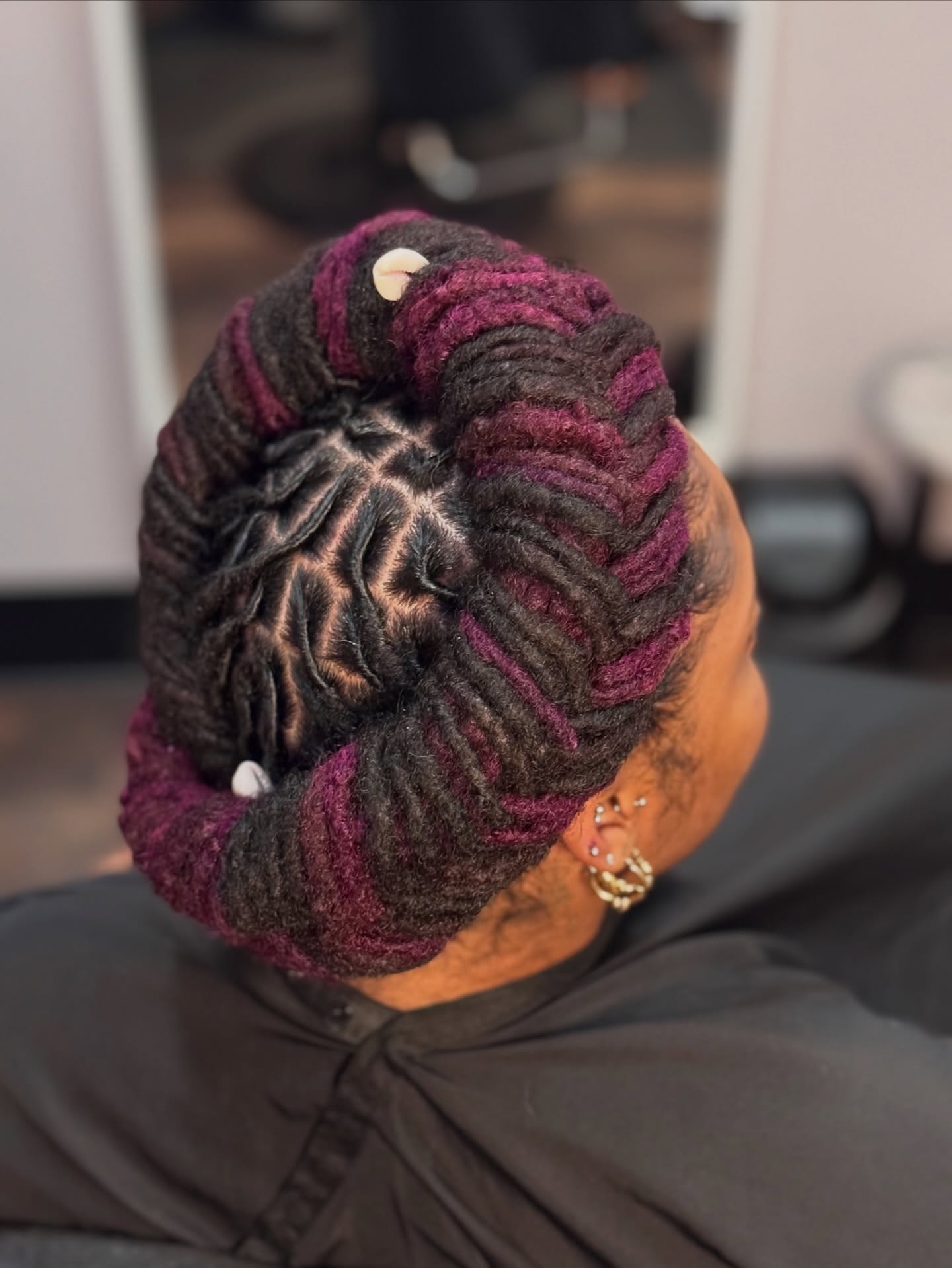 Stylish Twisted Updo with Purple Highlights