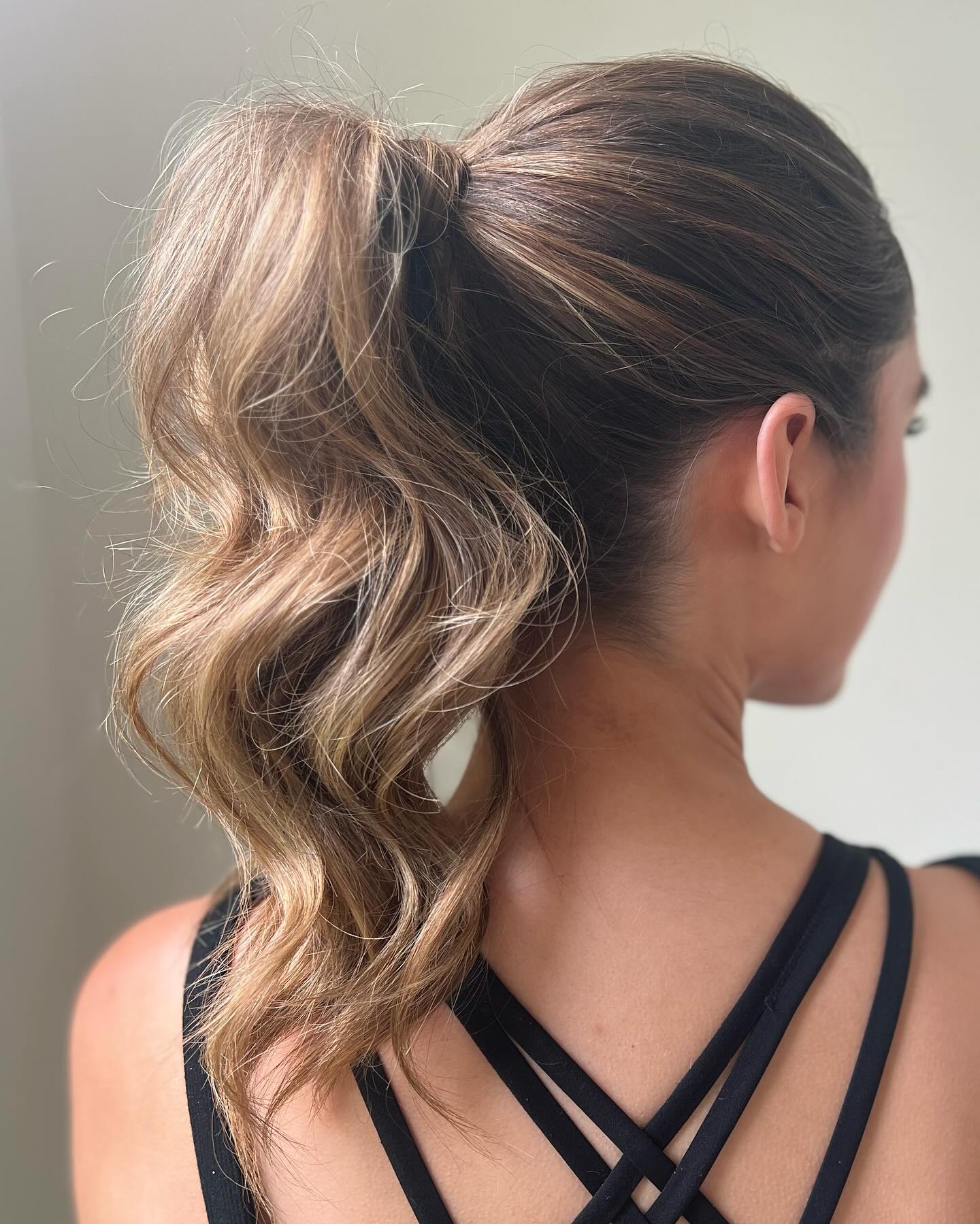 Textured High Ponytail with Loose Waves