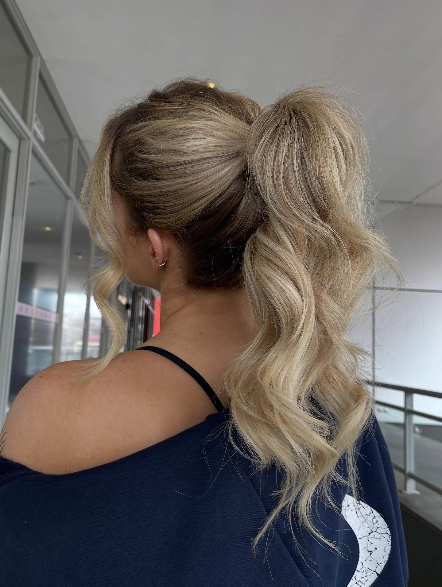 Textured Wavy High Ponytail with Face-Framing Layers
