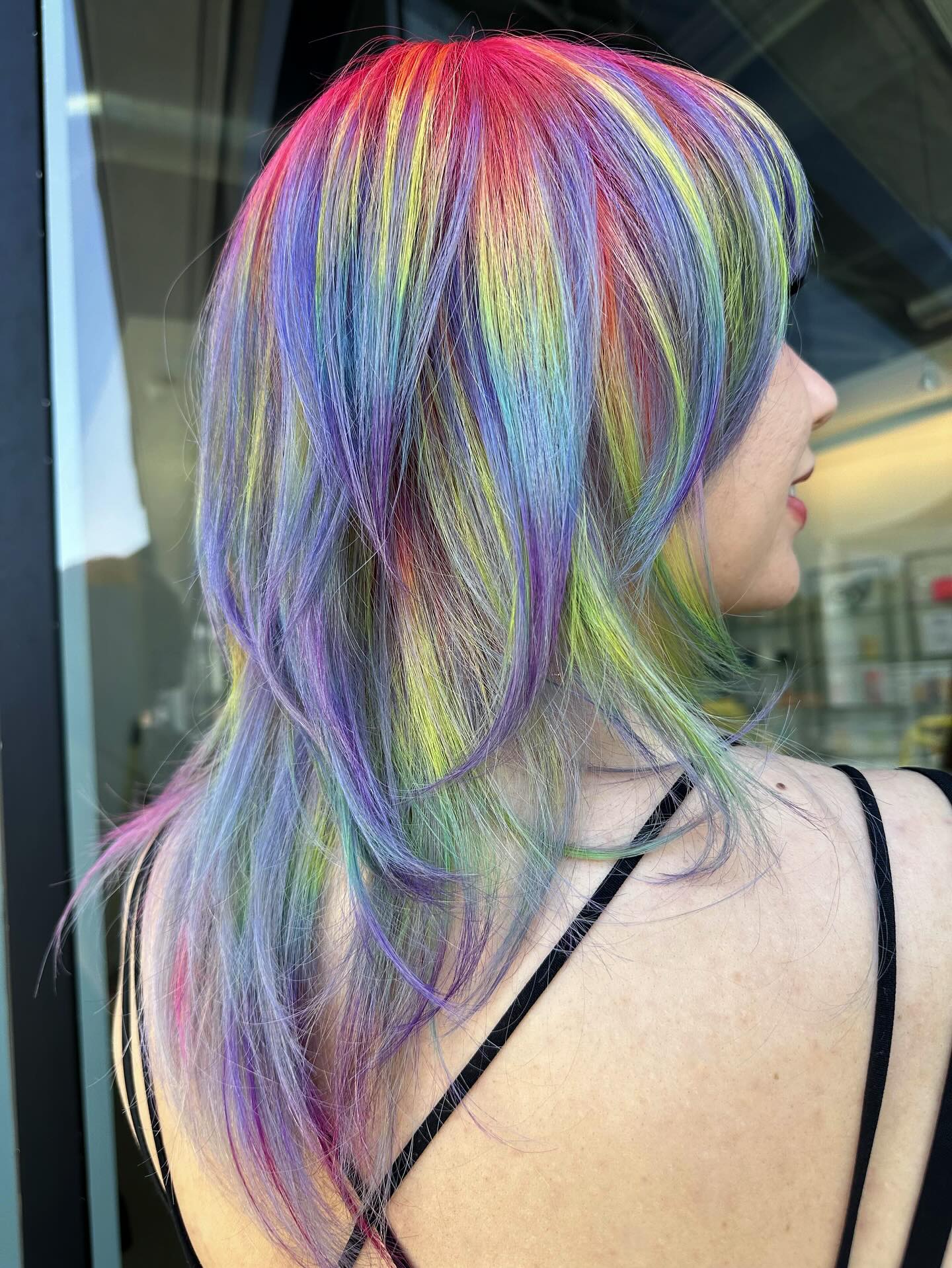 Vibrant Multicolored Layered Cut with Face-Framing Bangs