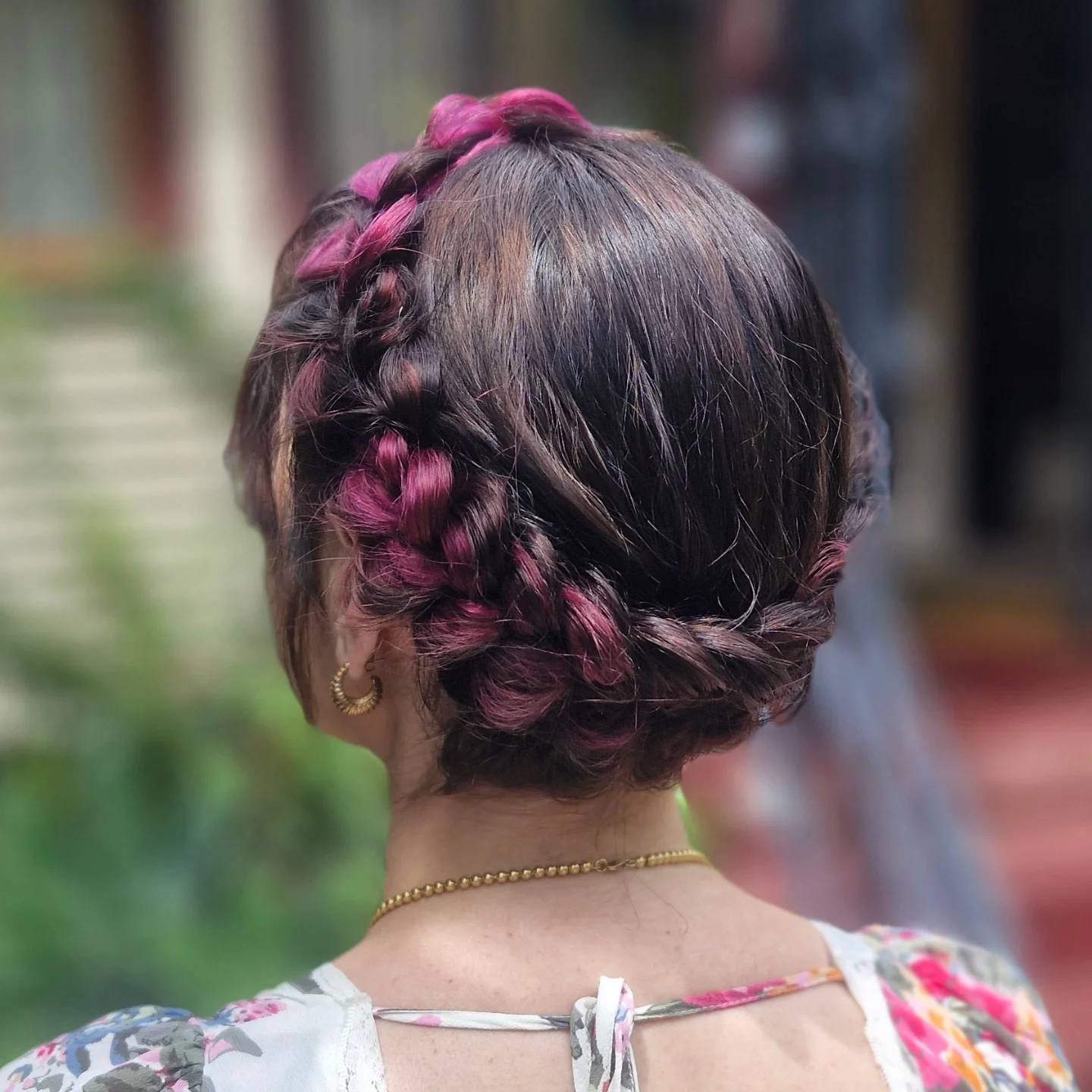 Chic Braided Bun with Subtle Pink Highlights