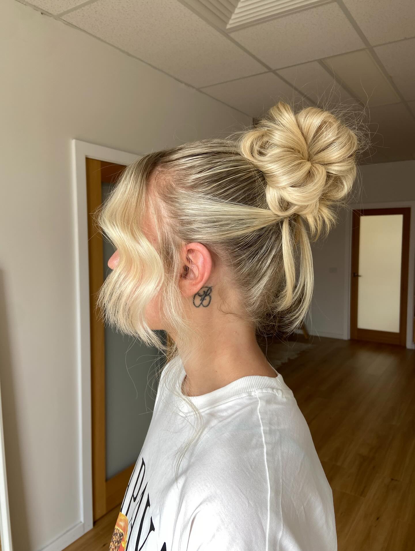 Chic High Bun with Soft Face-Framing Waves